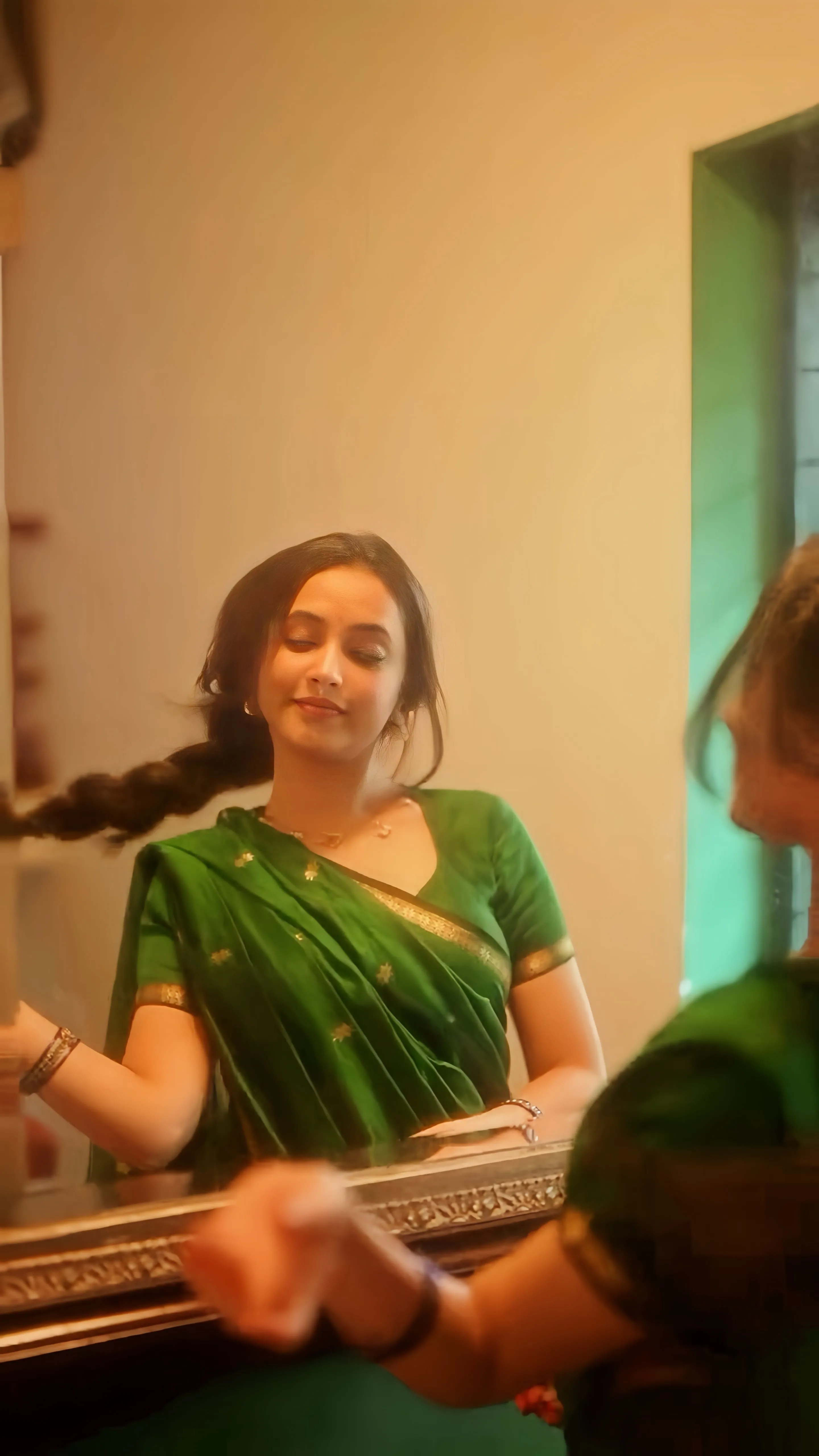 Priyanka Mohan in a Green Saree Standing in Front of Mirror