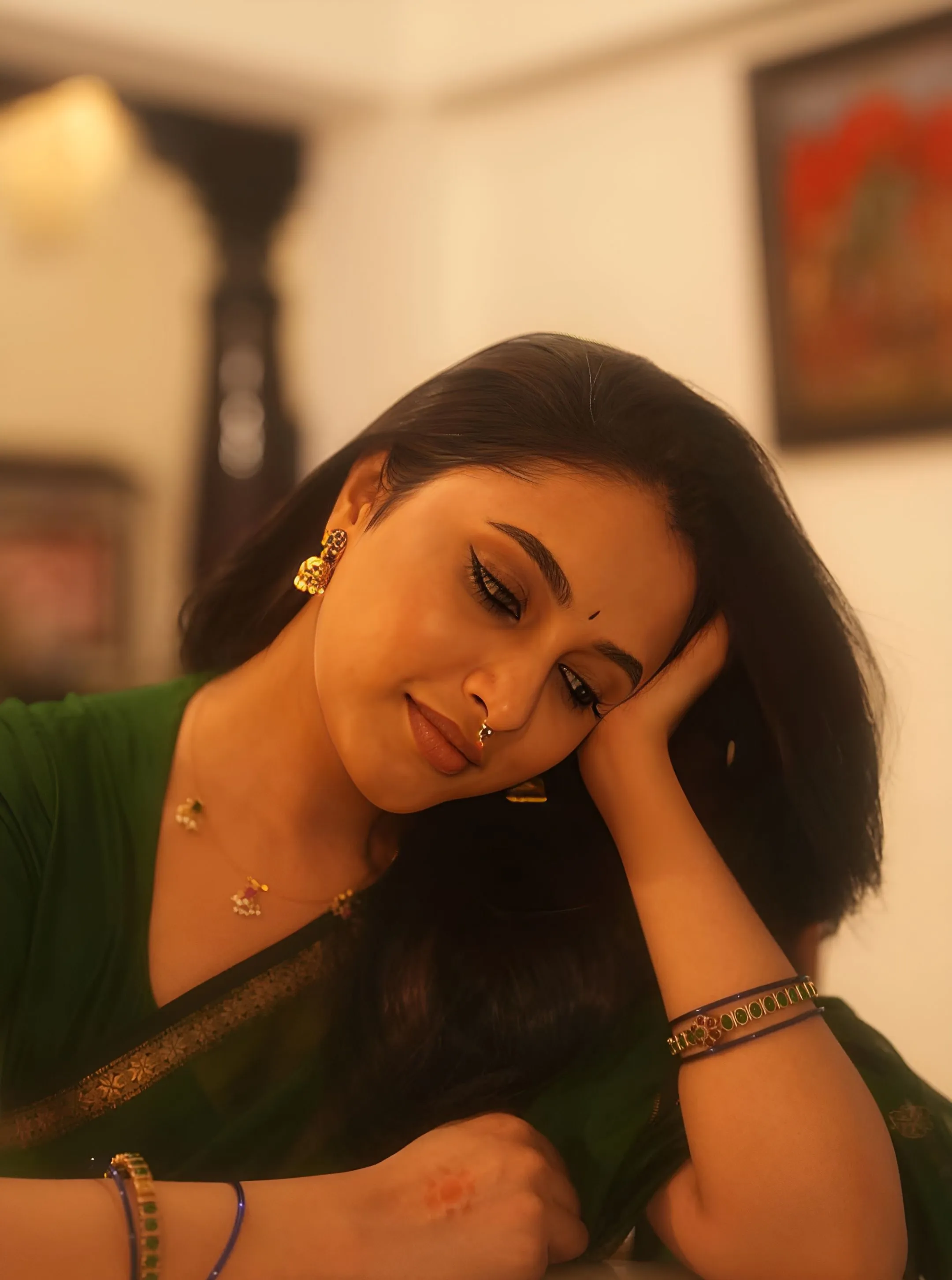Priyanka Mohan in a Green Saree with Her Hand on Her Head