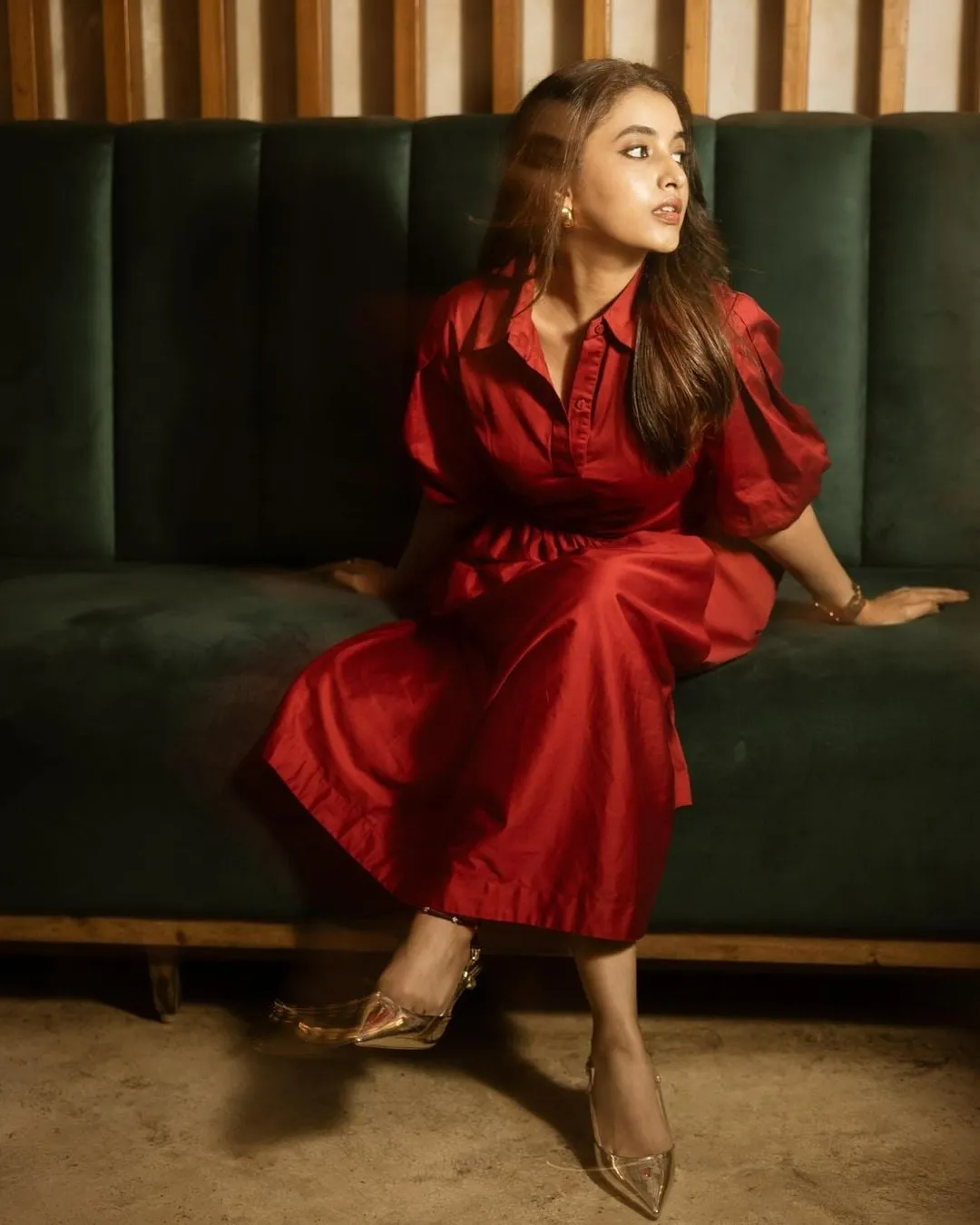Priyanka Mohan in a Maroon Midi Dress Sitting on Black Sofa