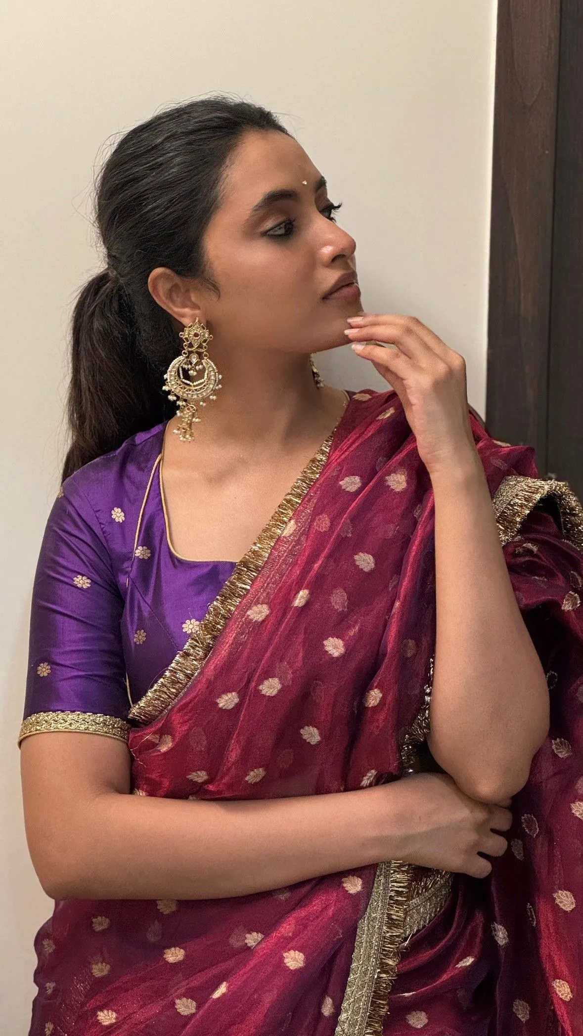 Priyanka Mohan in a Maroon Saree with a Thoughtful Pose