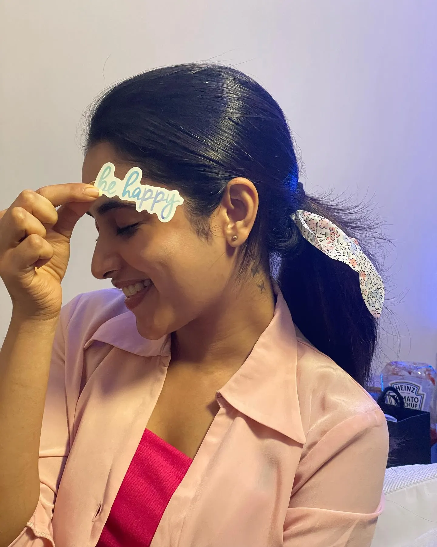 Priyanka Mohan in a Pink Outfit Holding a Be Happy Text