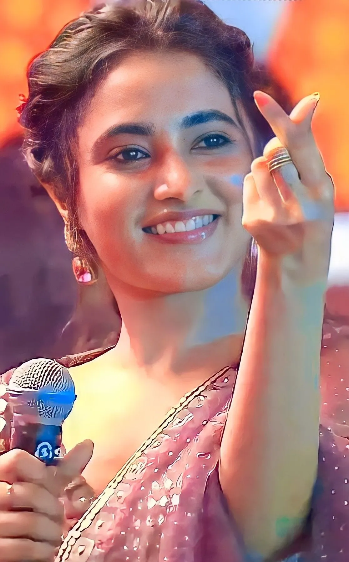 Priyanka Mohan in a Pink Saree Showing a Hand Heart Image