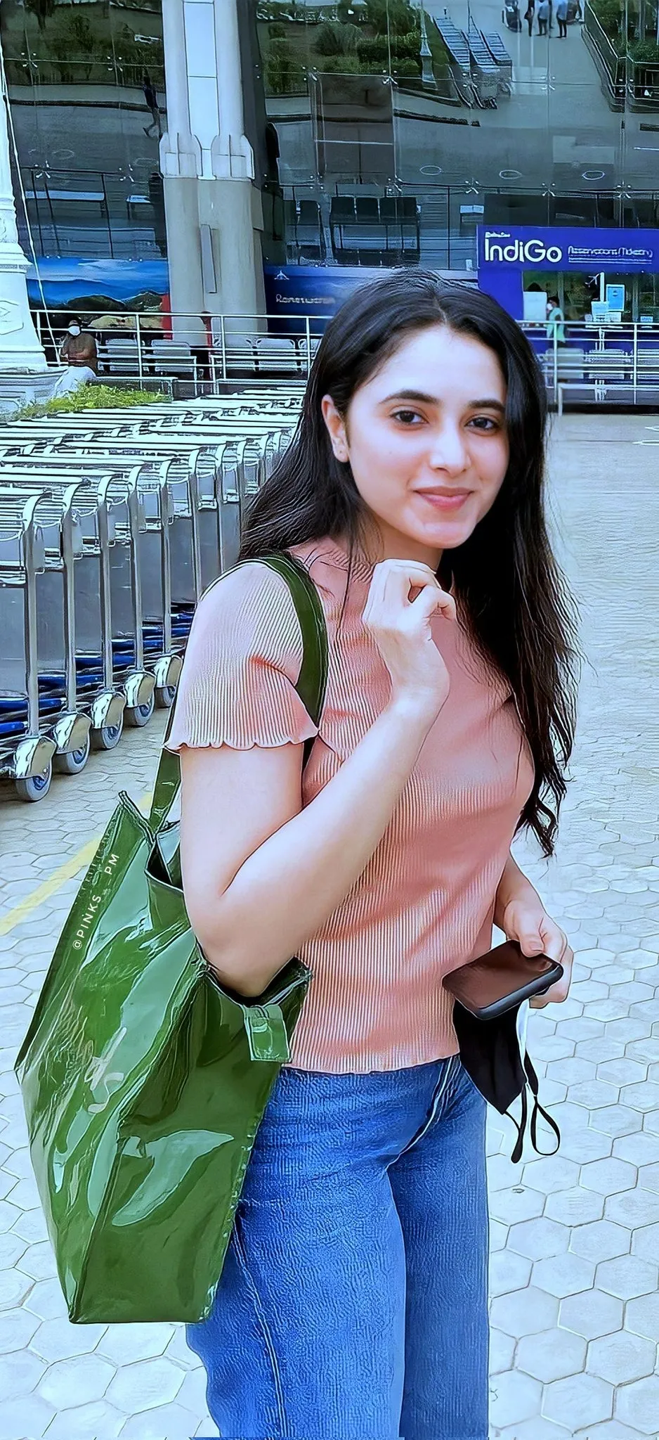Priyanka Mohan in a Pink Top And Blue Jeans Holding Handbag