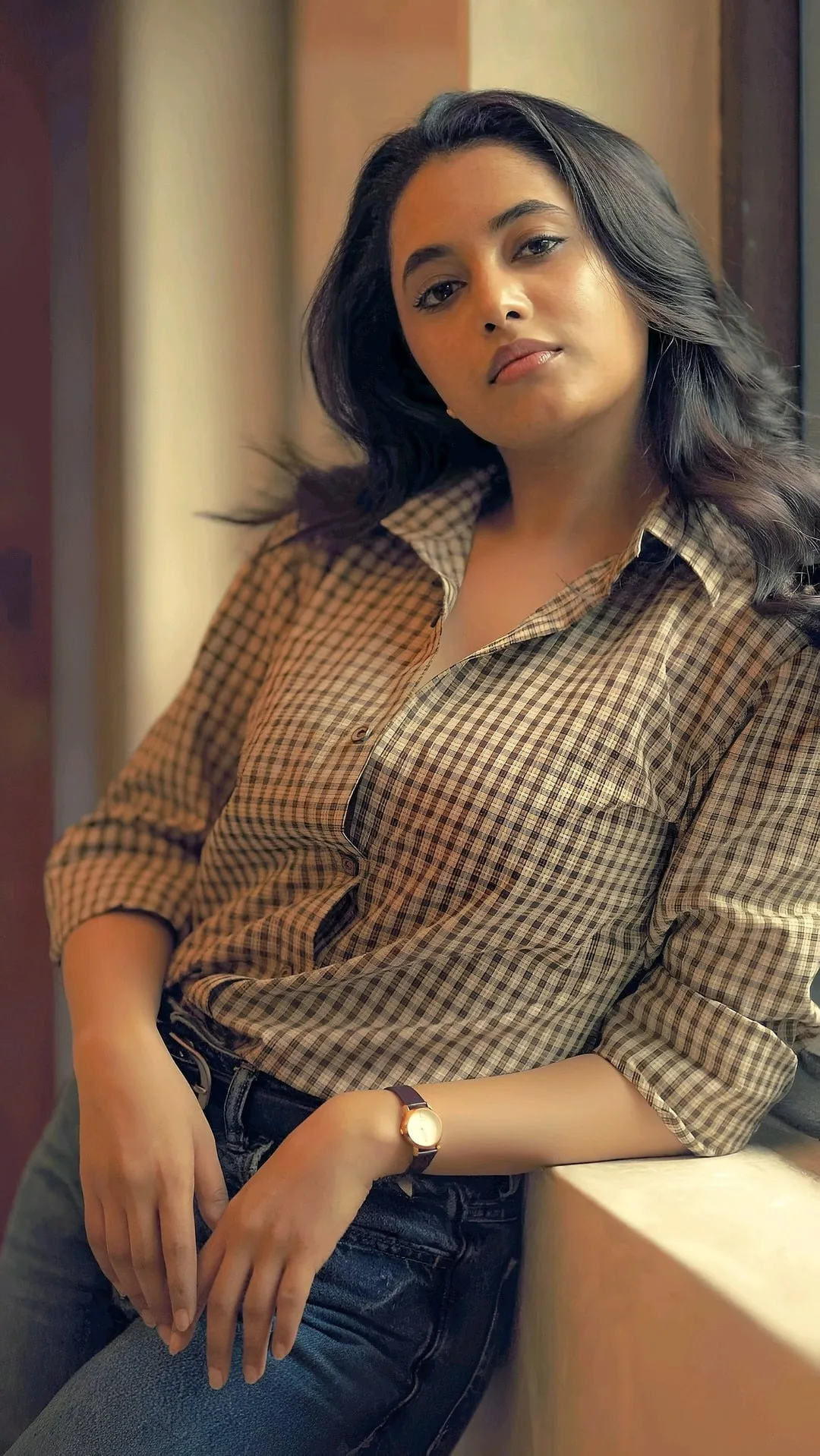 Priyanka Mohan in a Plaid Shirt Standing Near the Window