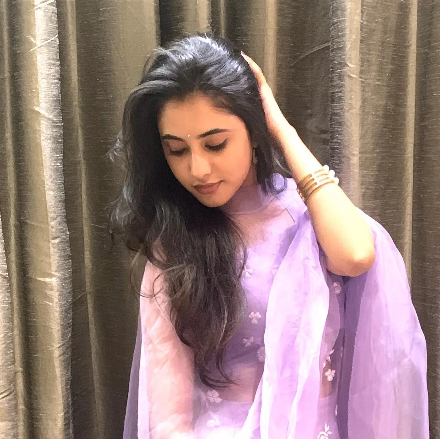 Priyanka Mohan in a Purple Dress with Her Hand on Her Head