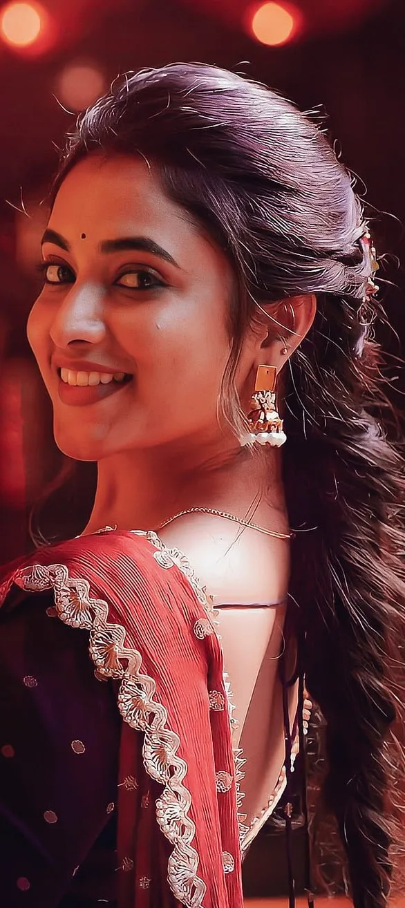 Priyanka Mohan in a Purple Saree with a Looking Back Pose
