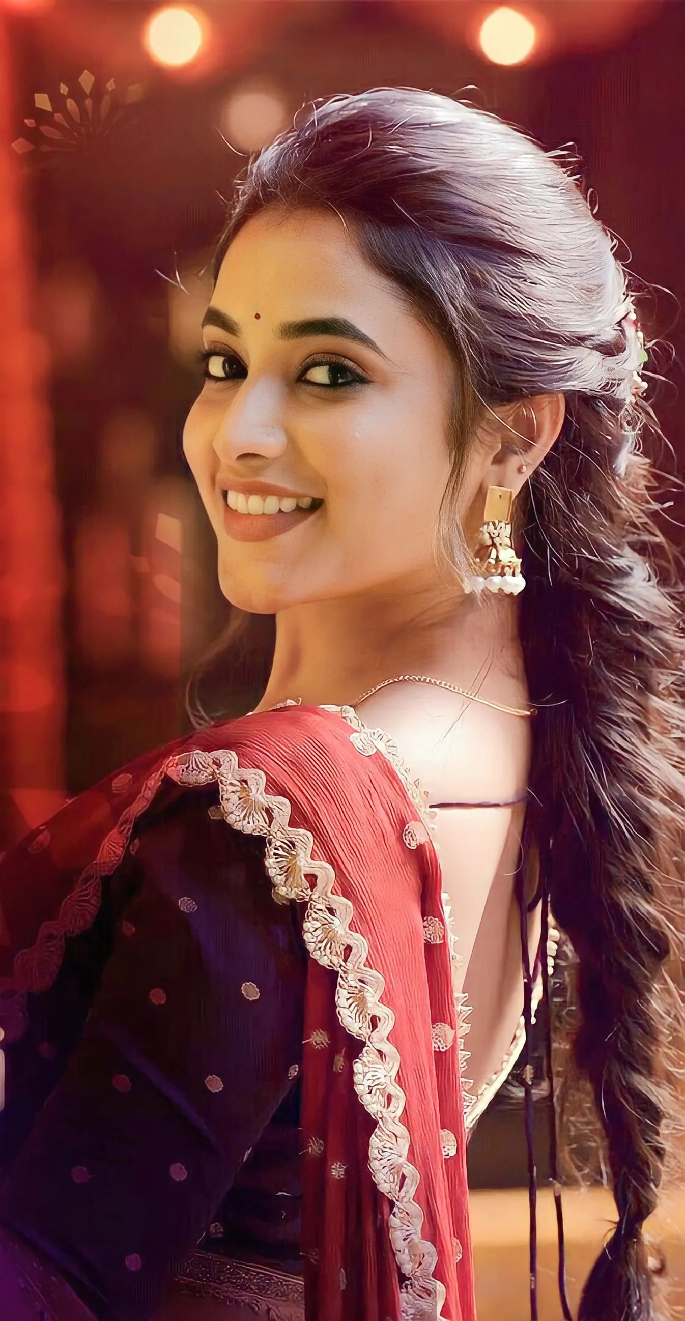 Priyanka Mohan in a Red And Blue Saree Looking at the Camera