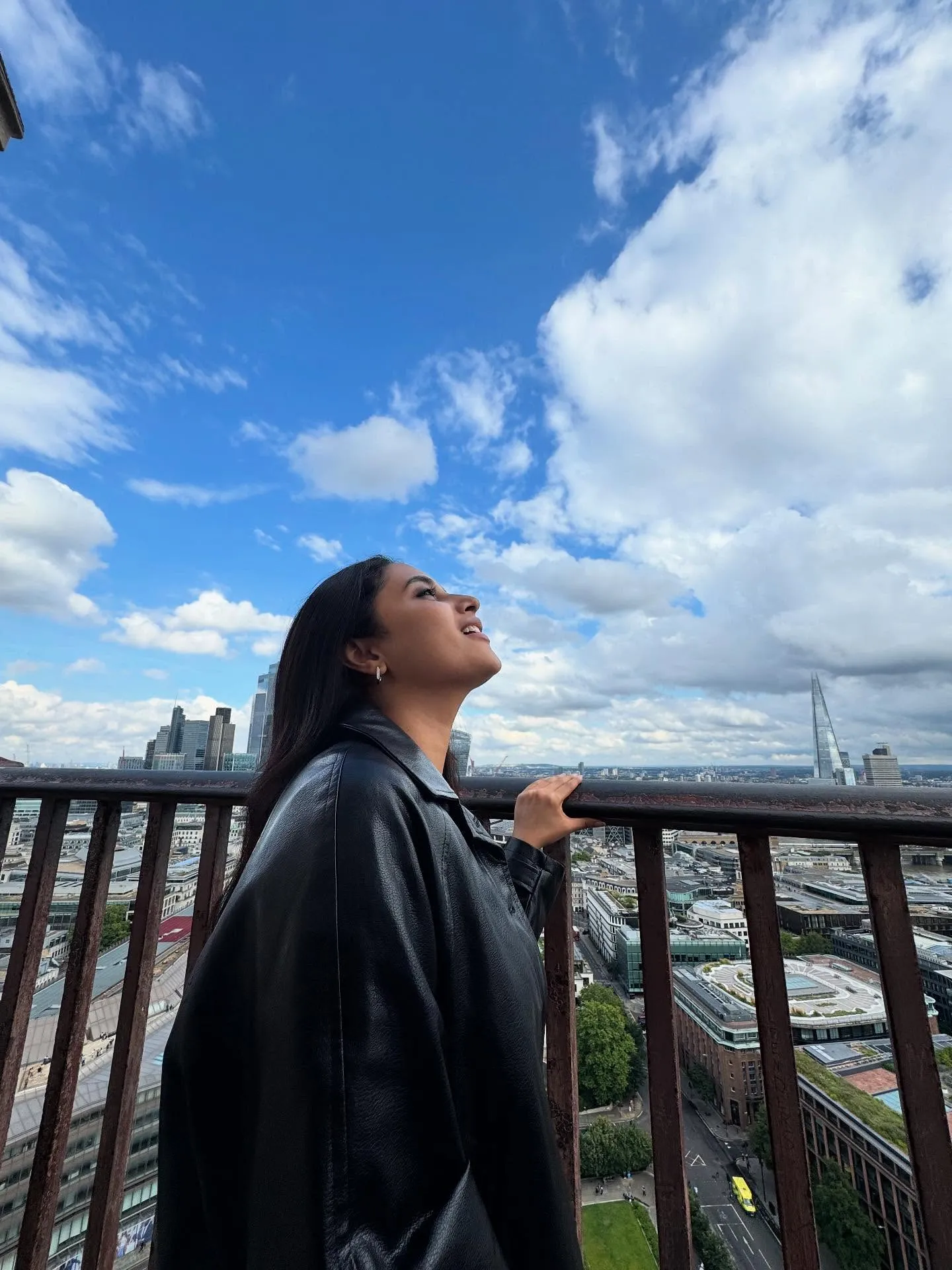 Priyanka Mohan in a Tall Building Wearing a Black Jacket