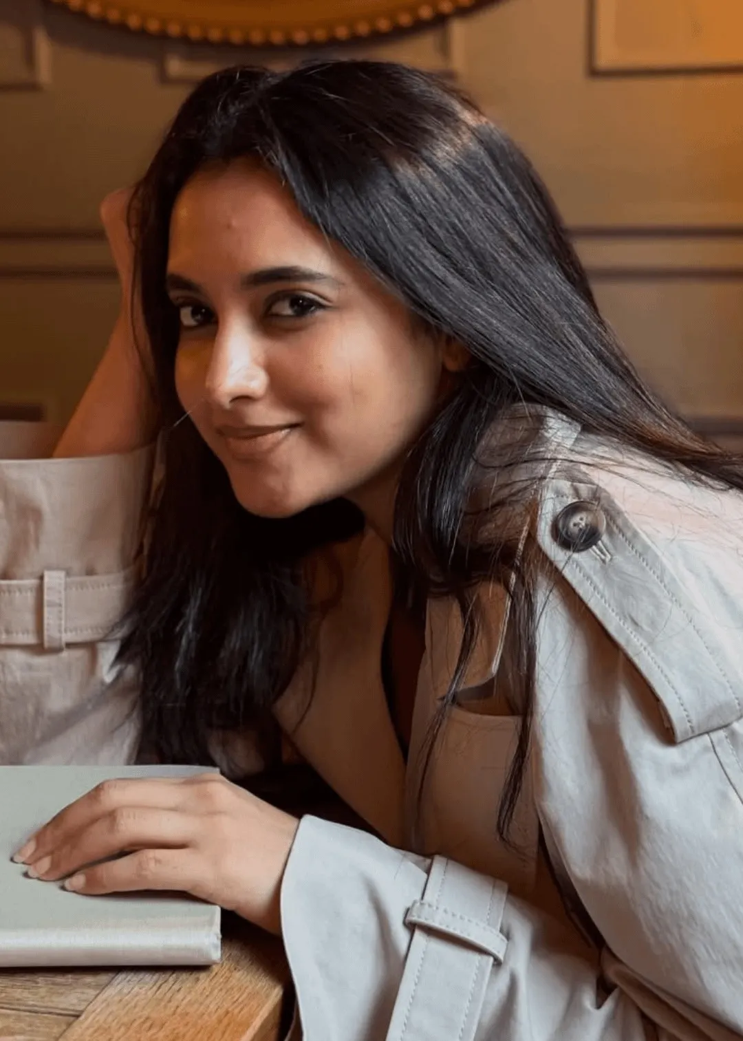 Priyanka Mohan in a Trench Coat Holding a Book Wallpaper