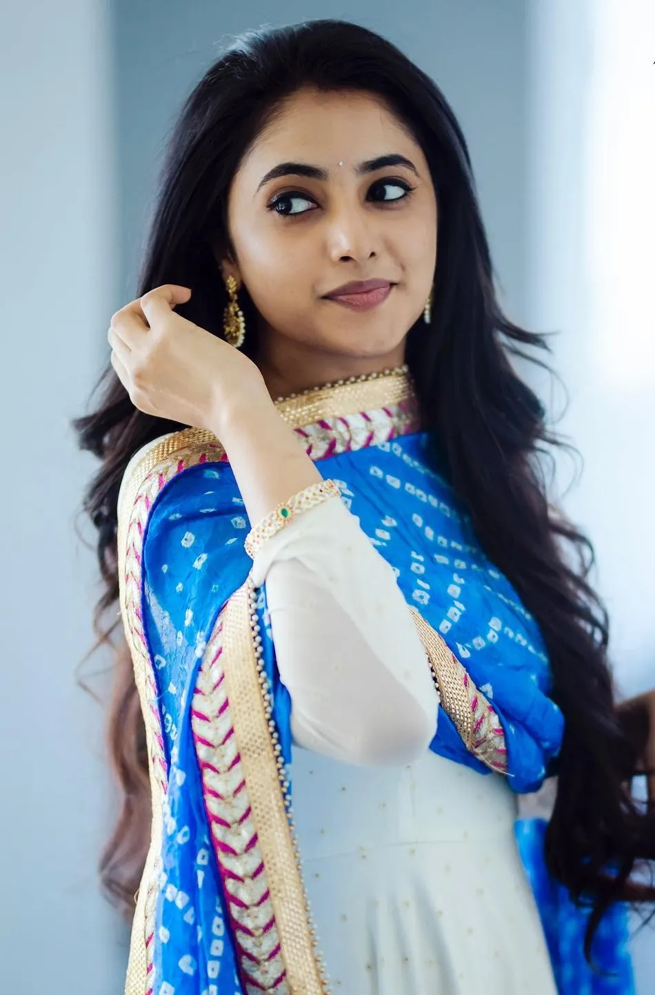 Priyanka Mohan in a White And Blue Dress Looking Back Pose