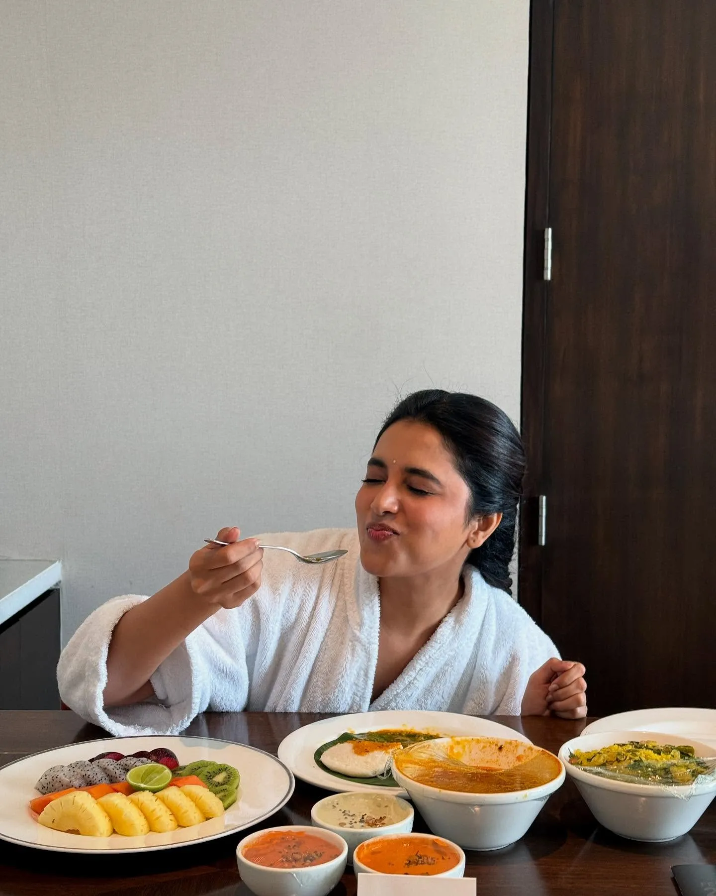 Priyanka Mohan in a White Outfit Eating Breakfast Wallpaper