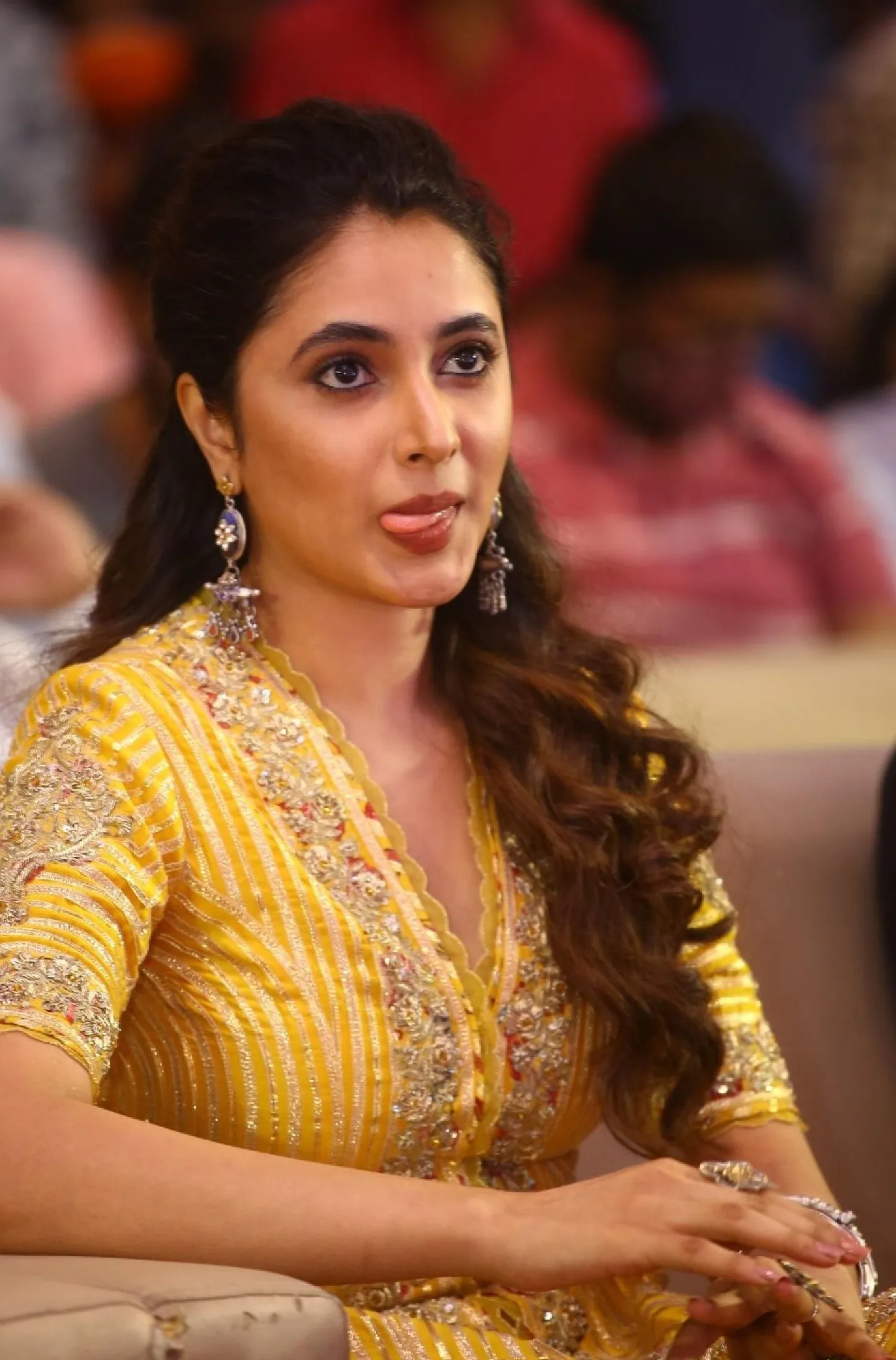 Priyanka Mohan in a Yellow Dress Showing Her Tongue Out