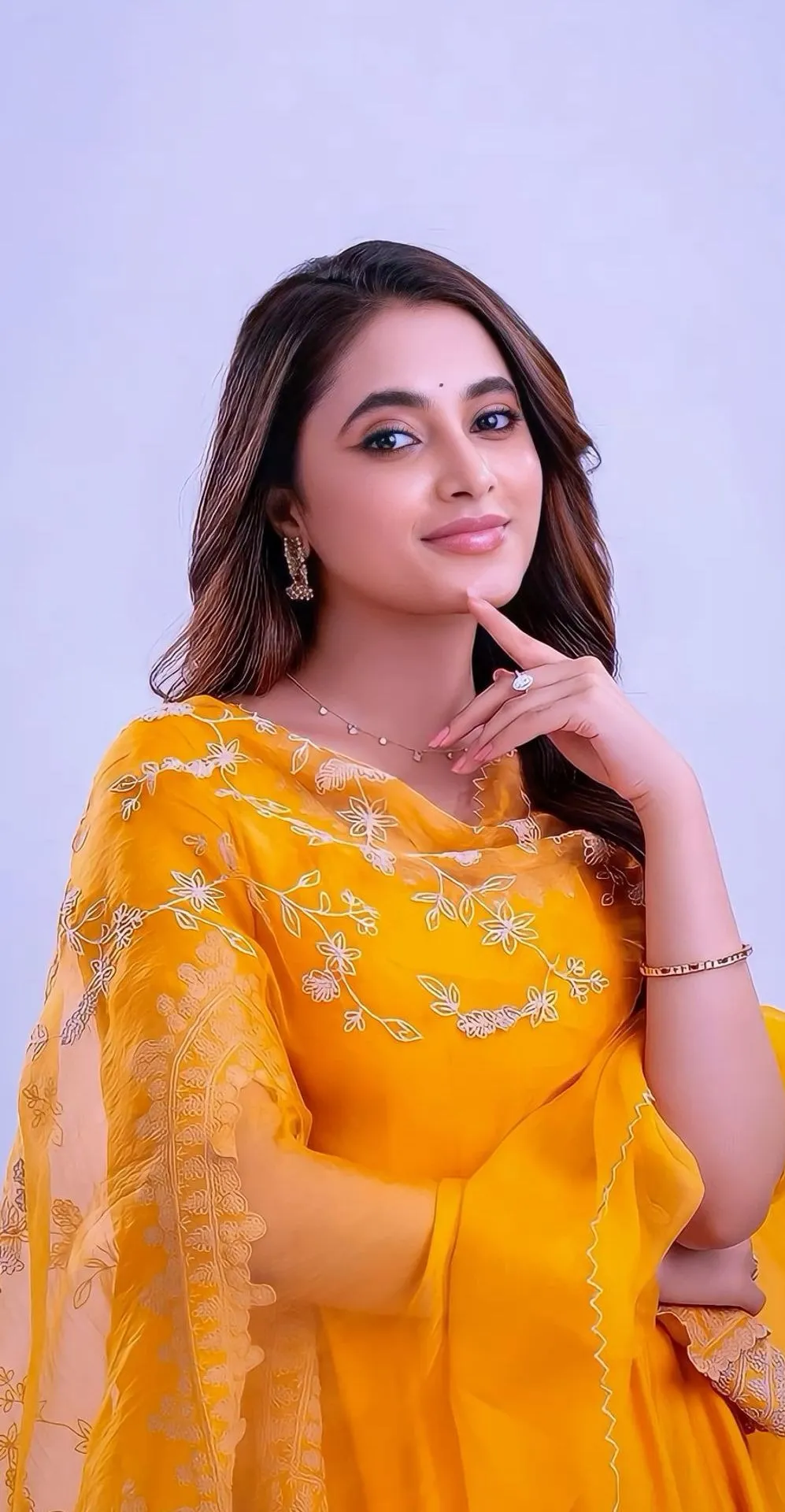 Priyanka Mohan in an Orange Dress with a Thoughtful Pose