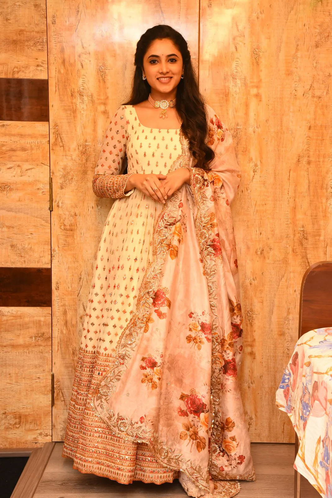 Priyanka Mohan in Anarkali Standing Near the Wooden Wall