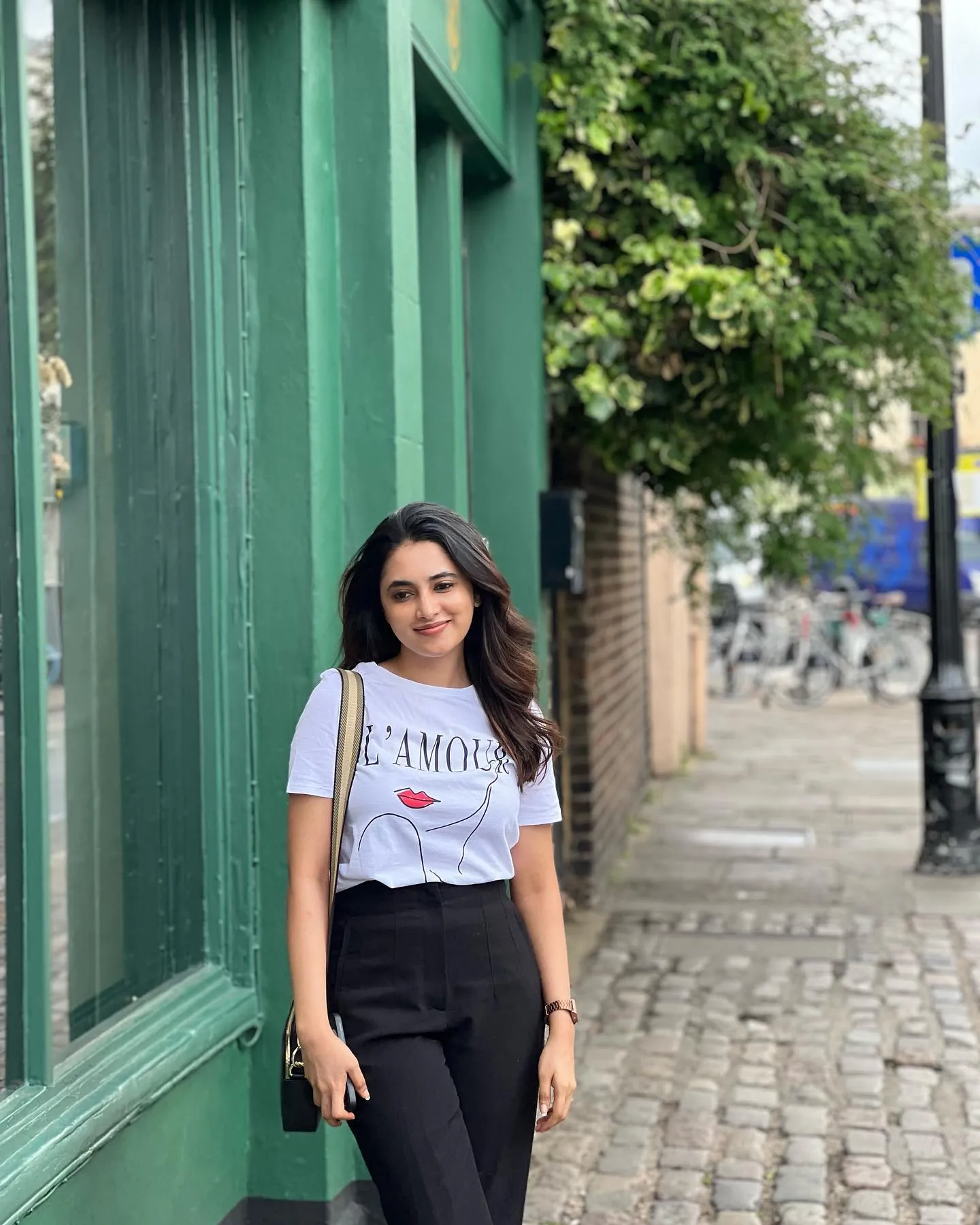 Priyanka Mohan in Black And White Outfit Standing Near Wall