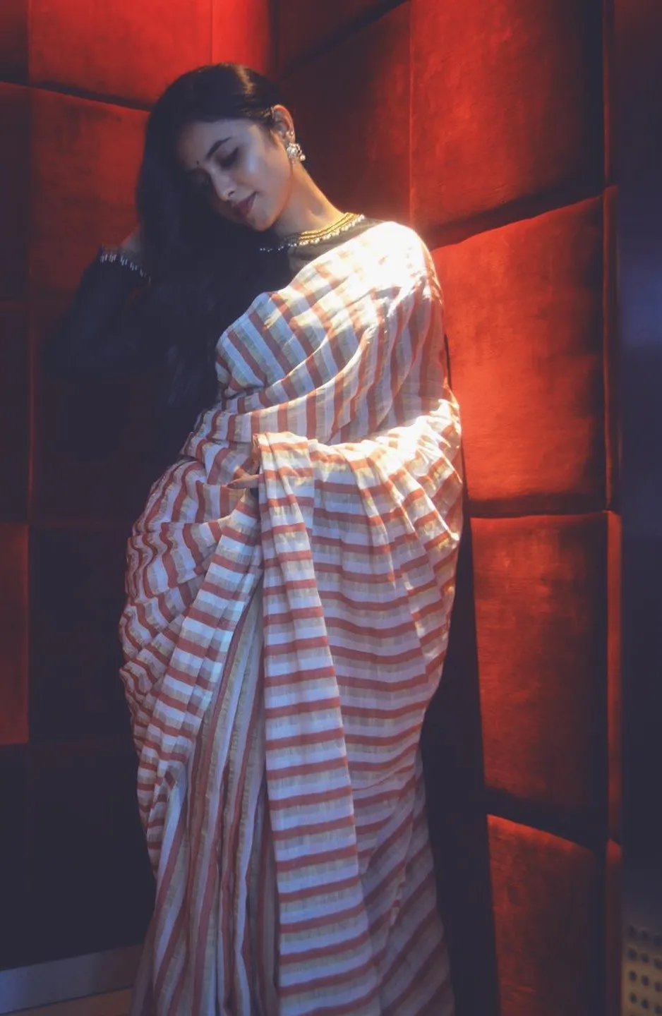 Priyanka Mohan in Classic Striped Saree leaning on Wall
