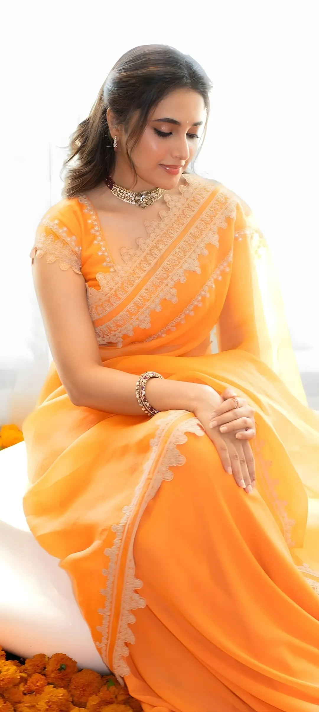 Priyanka Mohan in an Orange Saree Sitting in the Studio