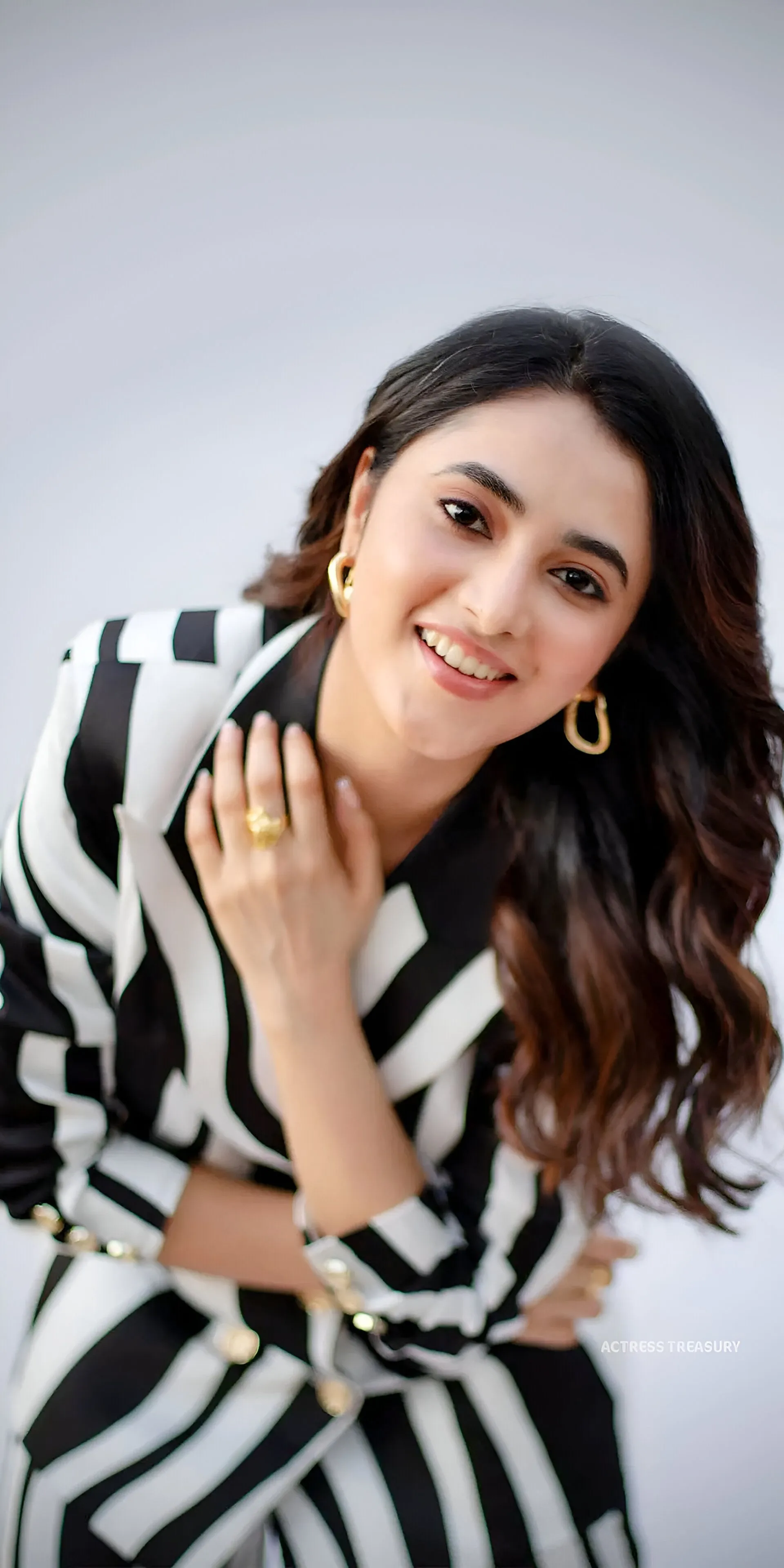 Priyanka Mohan in Zebra Lined Dress Standing Near White Wall