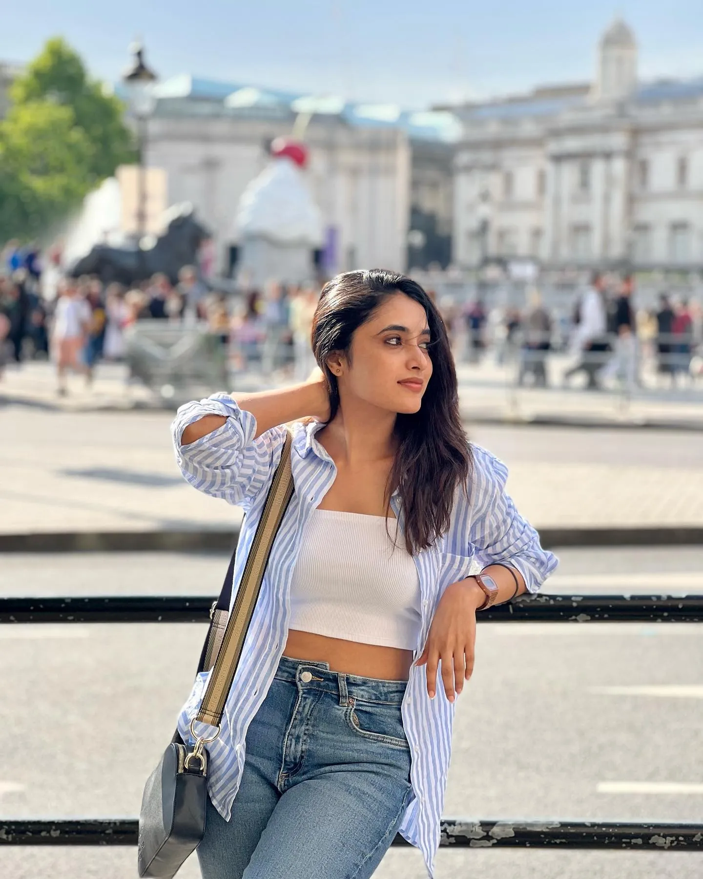 Priyanka Mohan Leaning in a Black Fence with Hand on Head