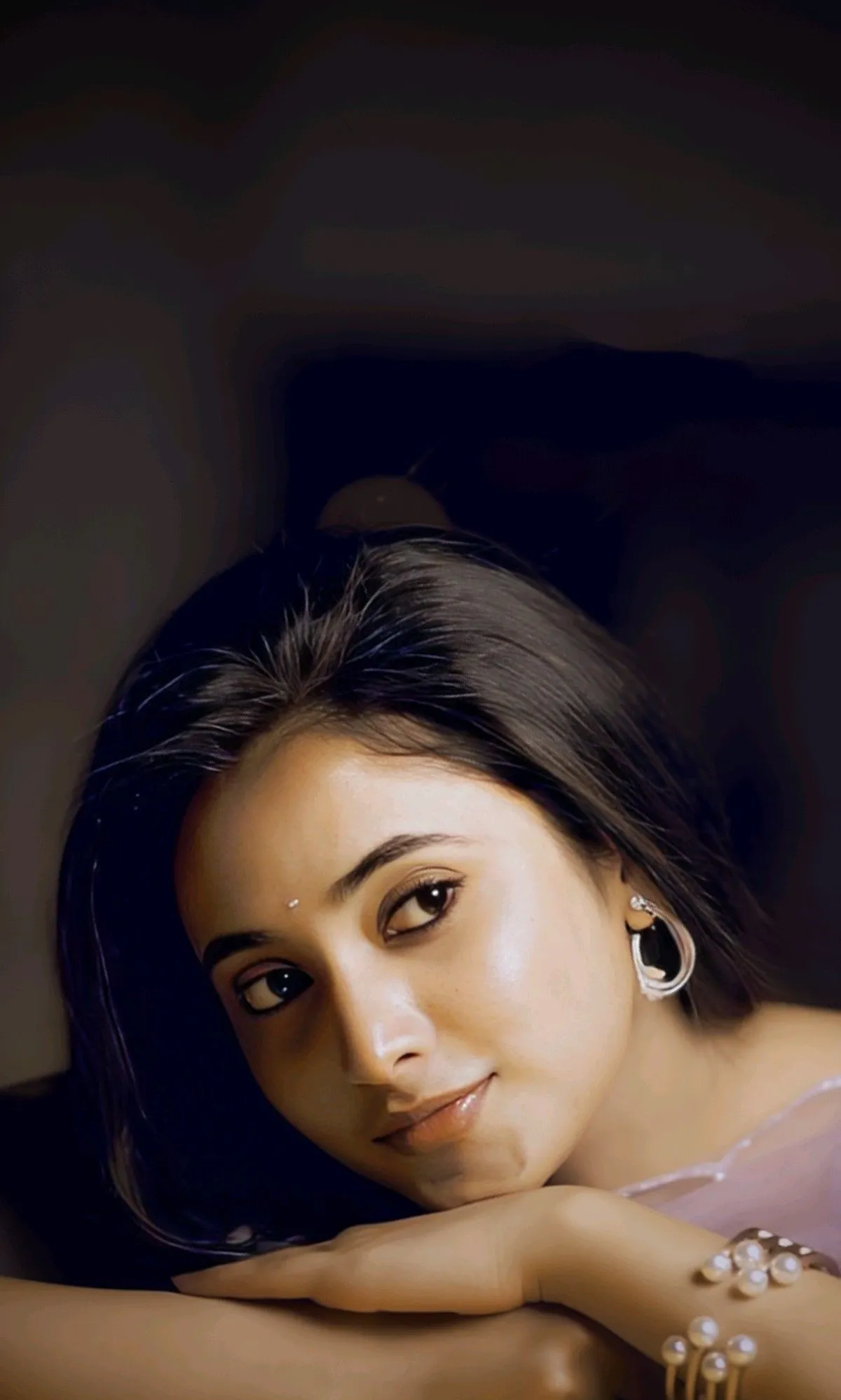 Priyanka Mohan Lying in Her Hand with Looking Side Pose