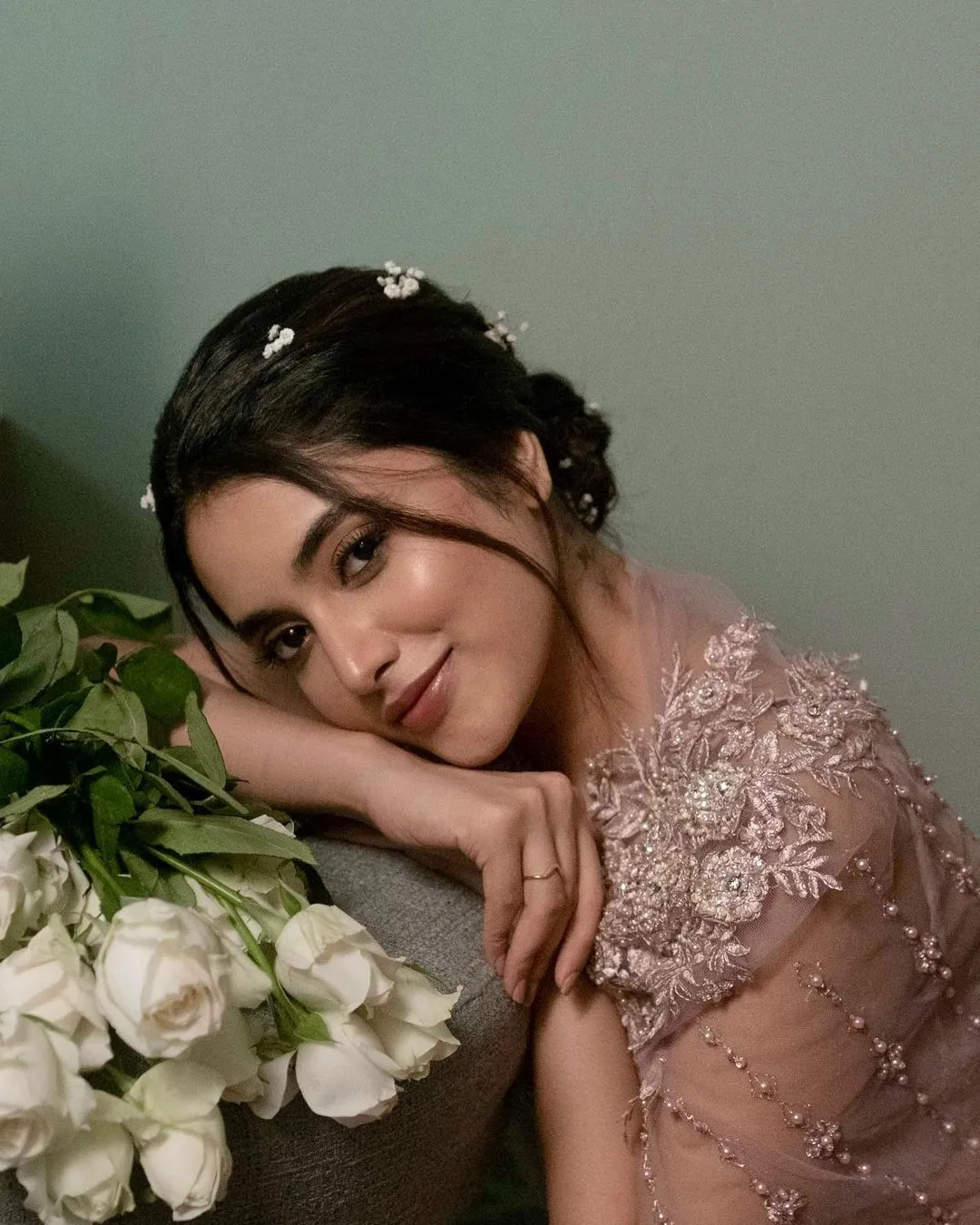 Priyanka Mohan Lying on the Sofa Near a White Rose Wallpaper