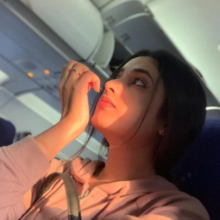 Priyanka Mohan relaxed in flight with peaceful expression
