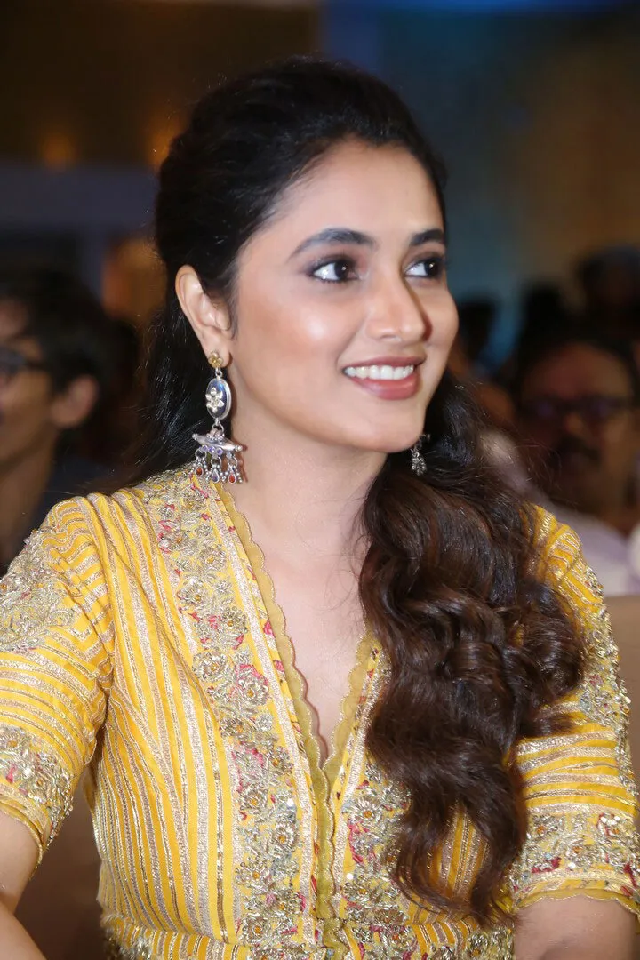 Priyanka Mohan Sitting at a Function Looking at a Side Pose
