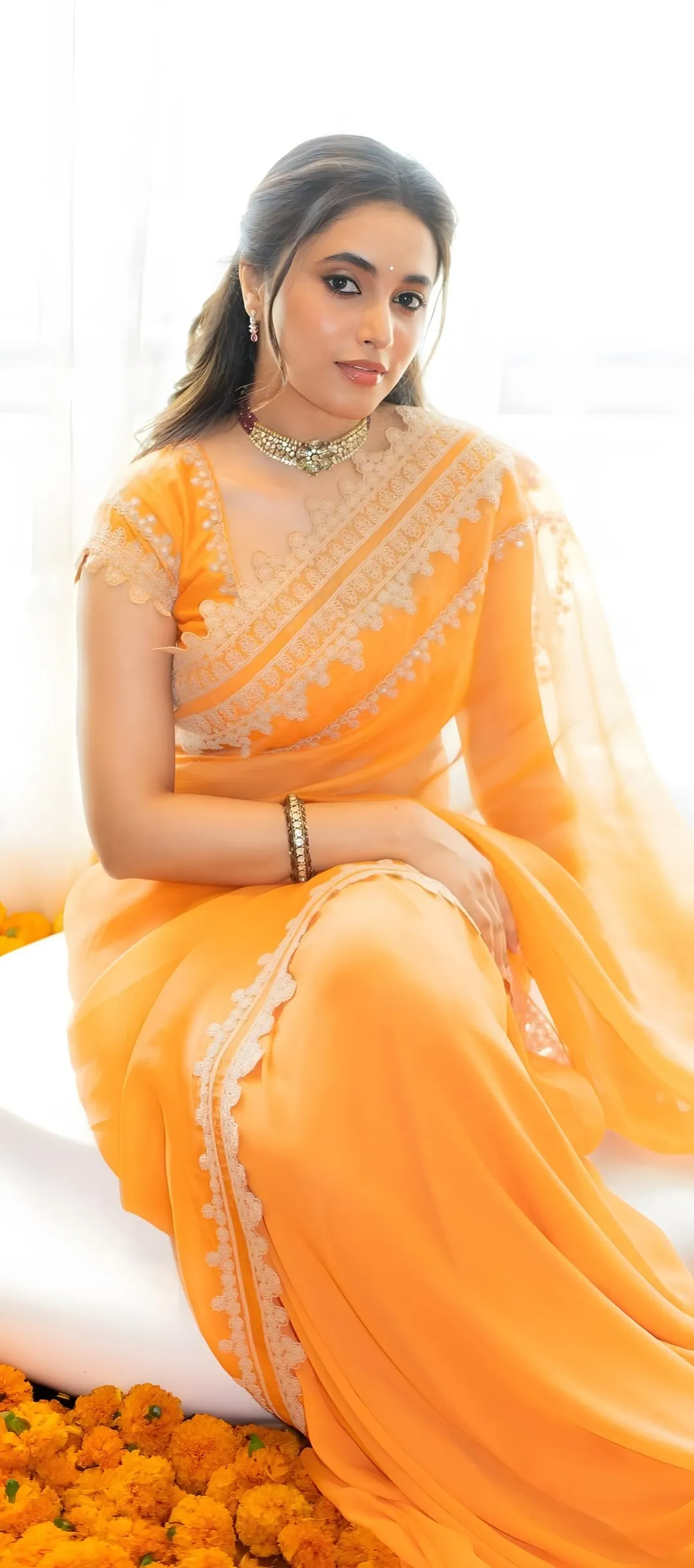 Priyanka Mohan Sitting in a White Cube Wearing a Saree