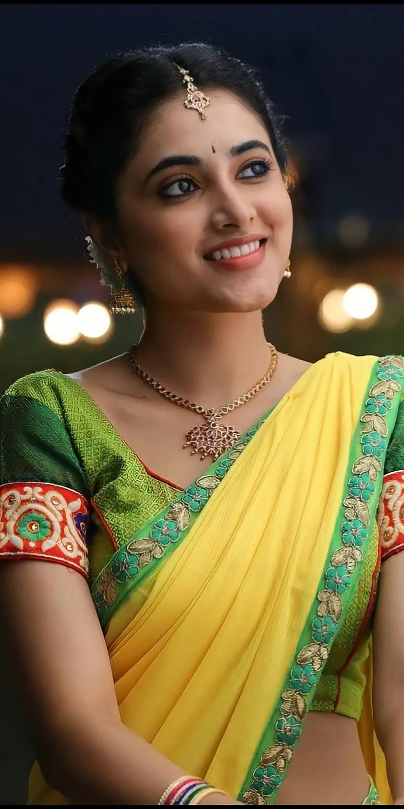 Priyanka Mohan Smiling in Yellow green Traditional Saree