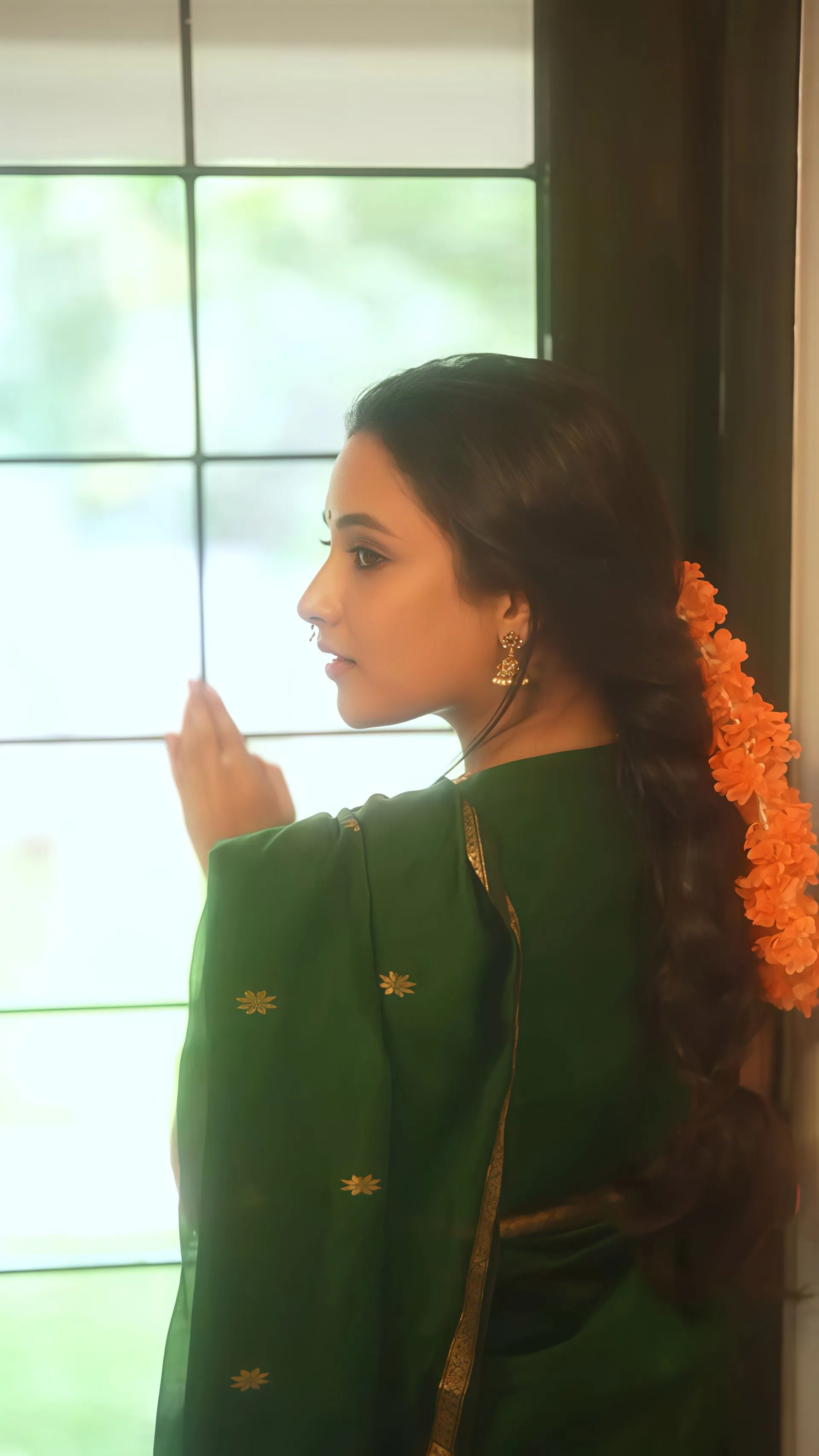 Priyanka Mohan Standing Near the Window Wearing Green Saree