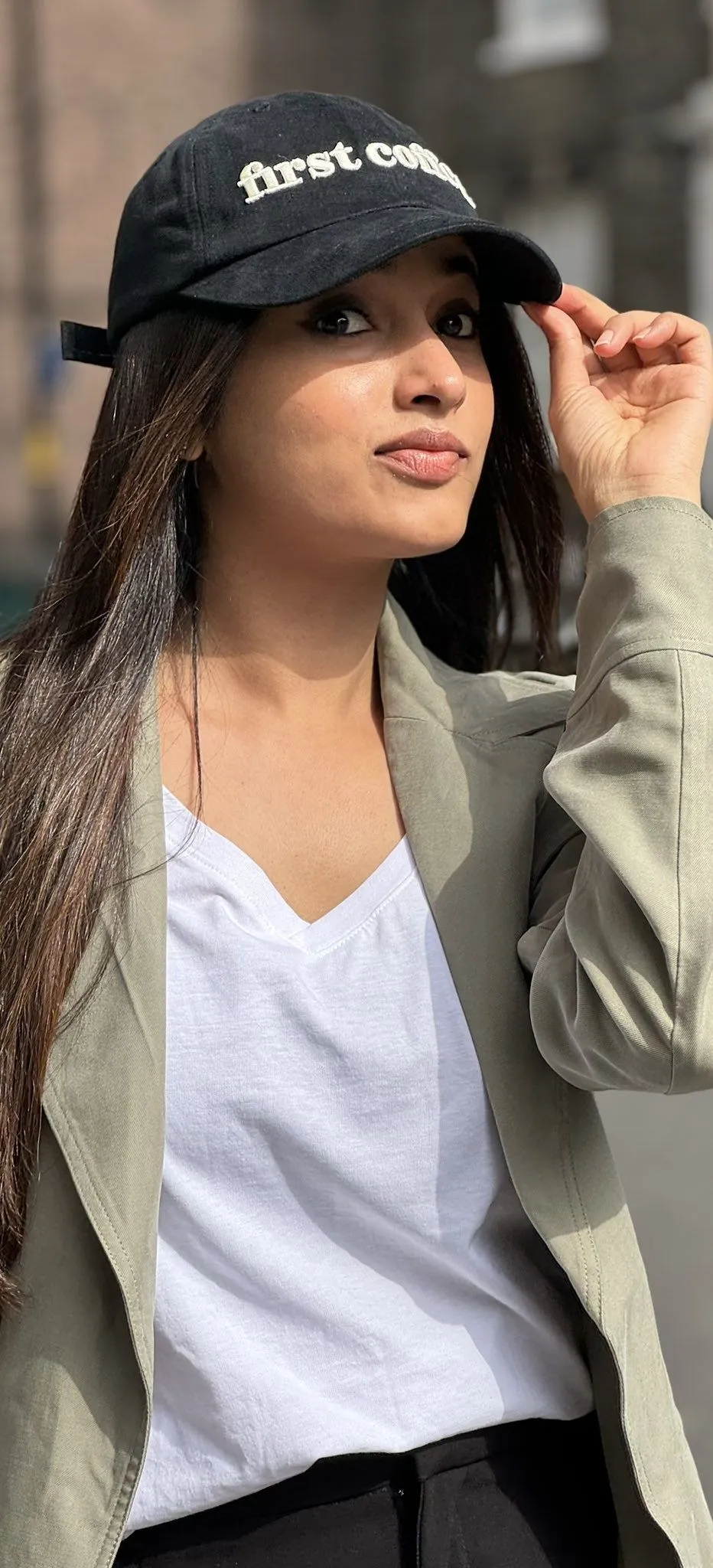 Priyanka Mohan Standing Outdoors Wearing a Cap Wallpaper