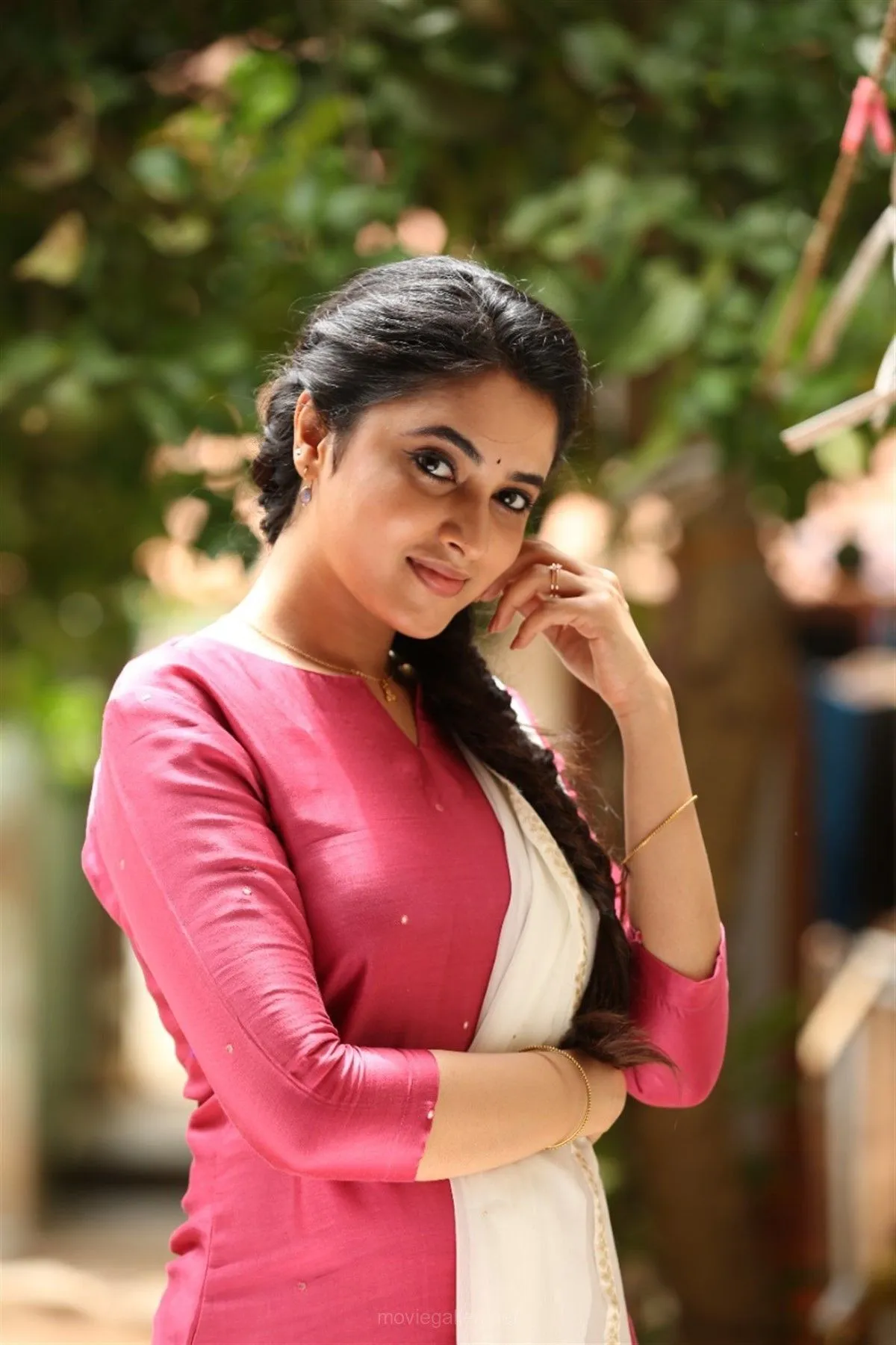 Priyanka Mohan Standing Outdoors Wearing a Pink Dress