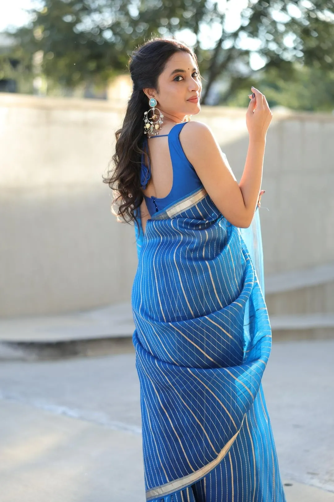 Priyanka Mohan Wearing a Blue Saree with a Cute Smile Image