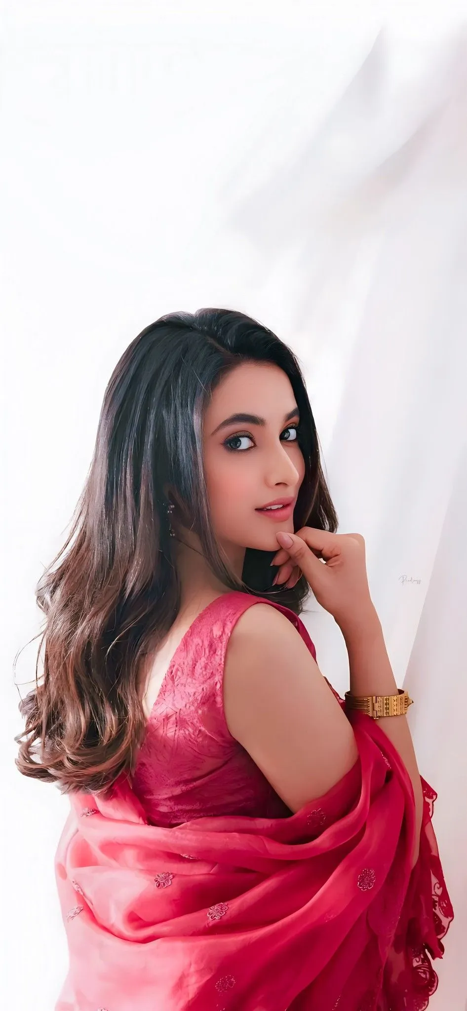Priyanka Mohan Wearing Red Dress and Looking Over Shoulder