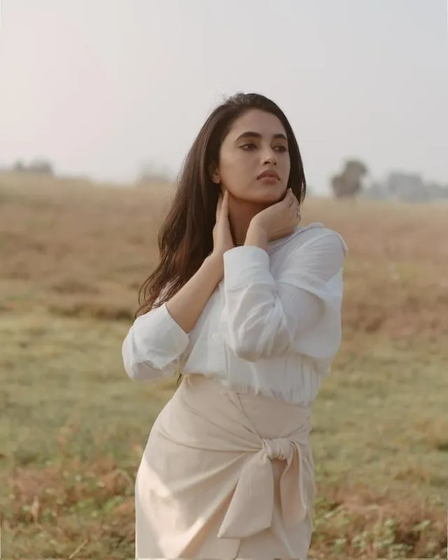 Priyanka Mohan wearing white and beige outfit at outside