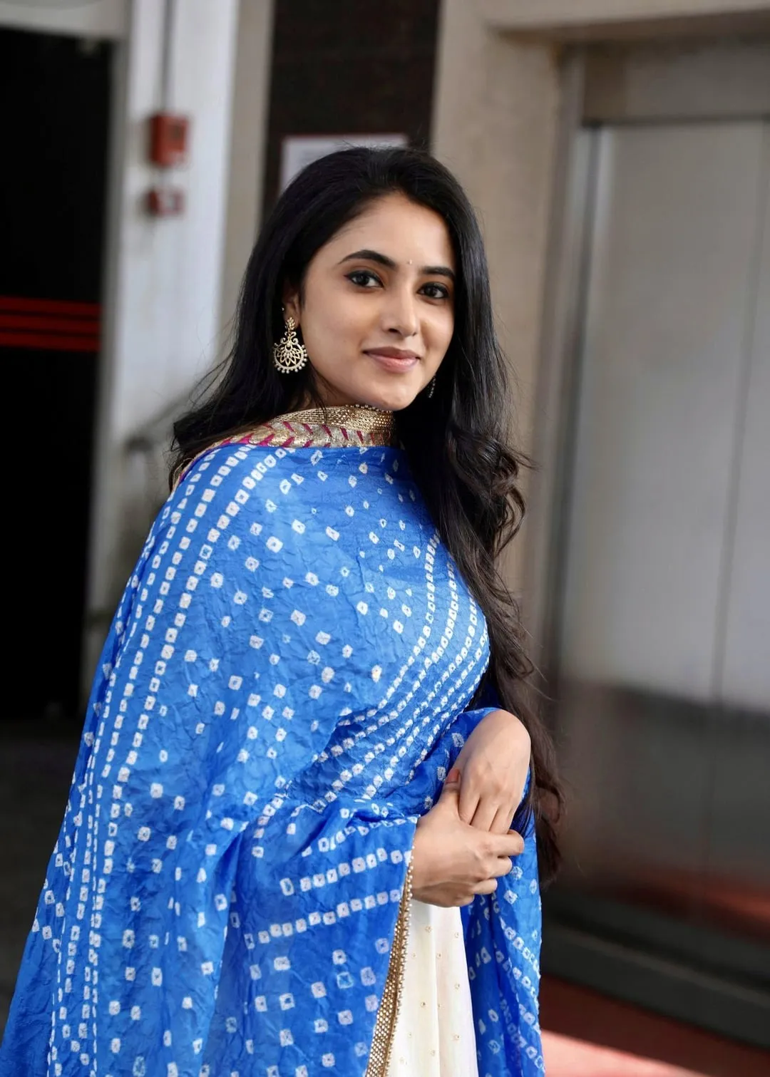 Priyanka Mohan with a Cute Pose Wearing White And Blue Dress