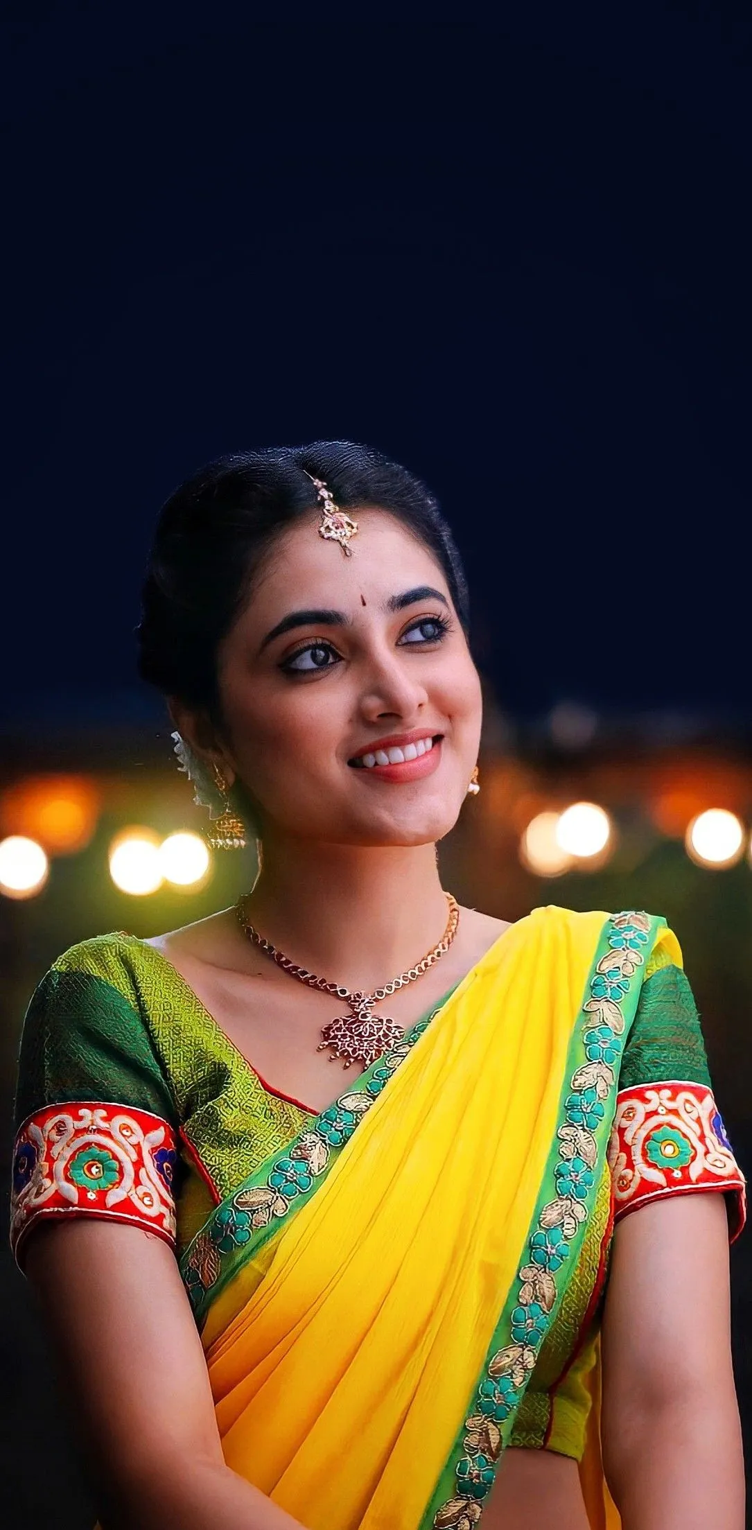 Priyanka Mohan with a Cute Smile Wearing a Yellow Saree