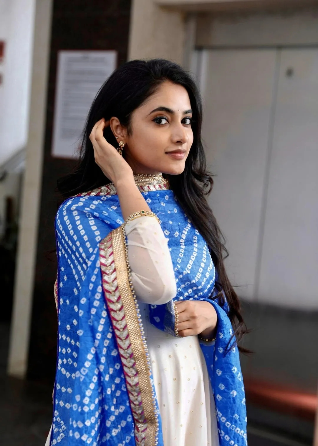 Priyanka Mohan with Her Hand on Hair in White And Blue Dress