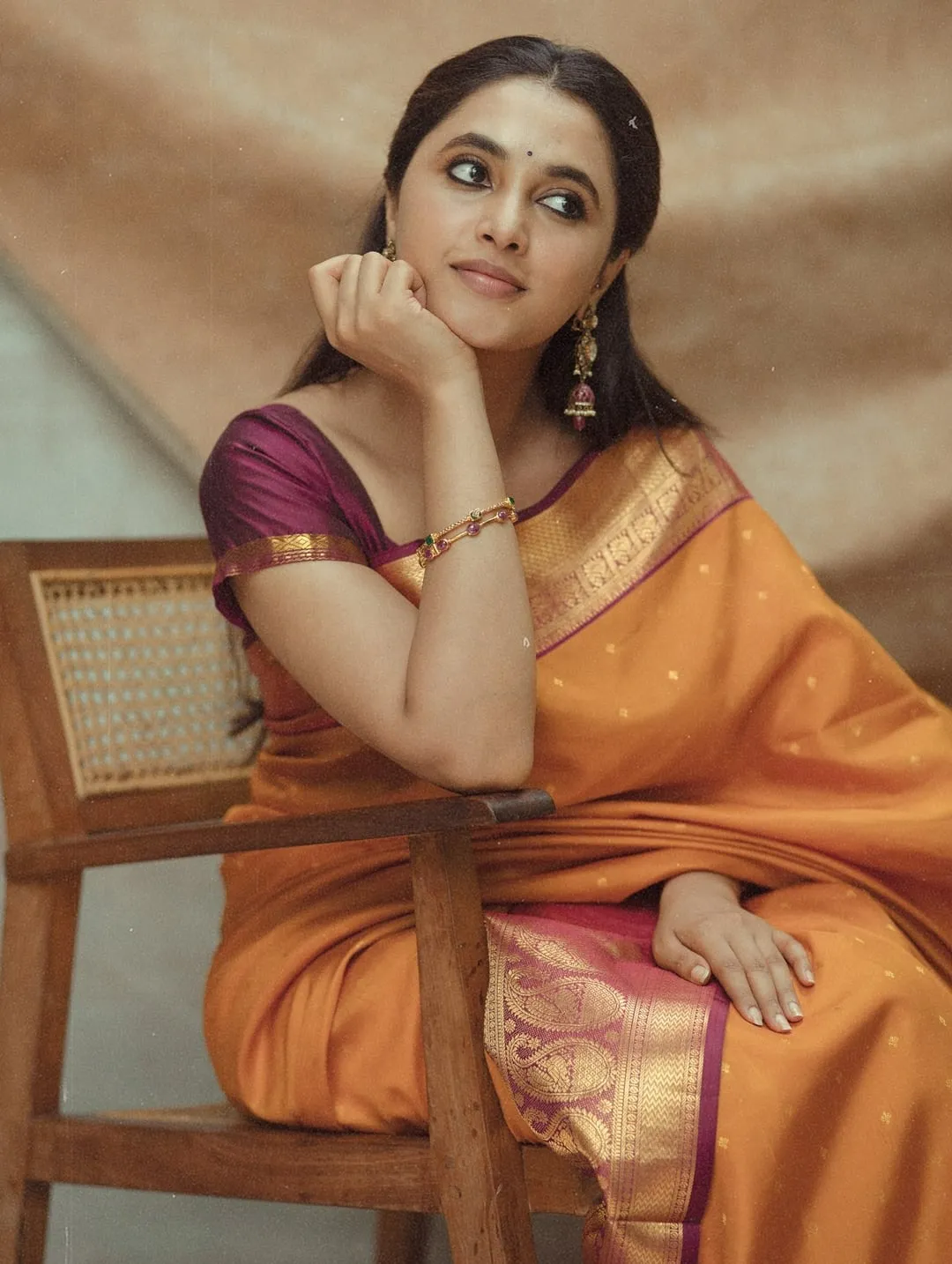 Priyanka Mohan with Her Hand on Her Chin Wearing a Saree