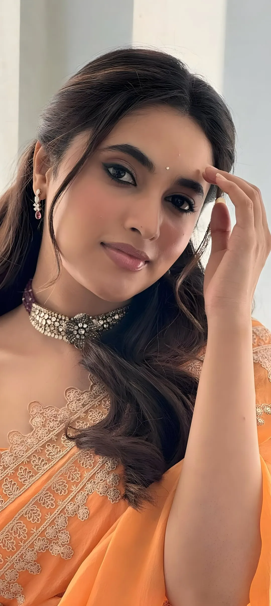 Priyanka Mohan with Her Hand on Her Head Wearing a Saree