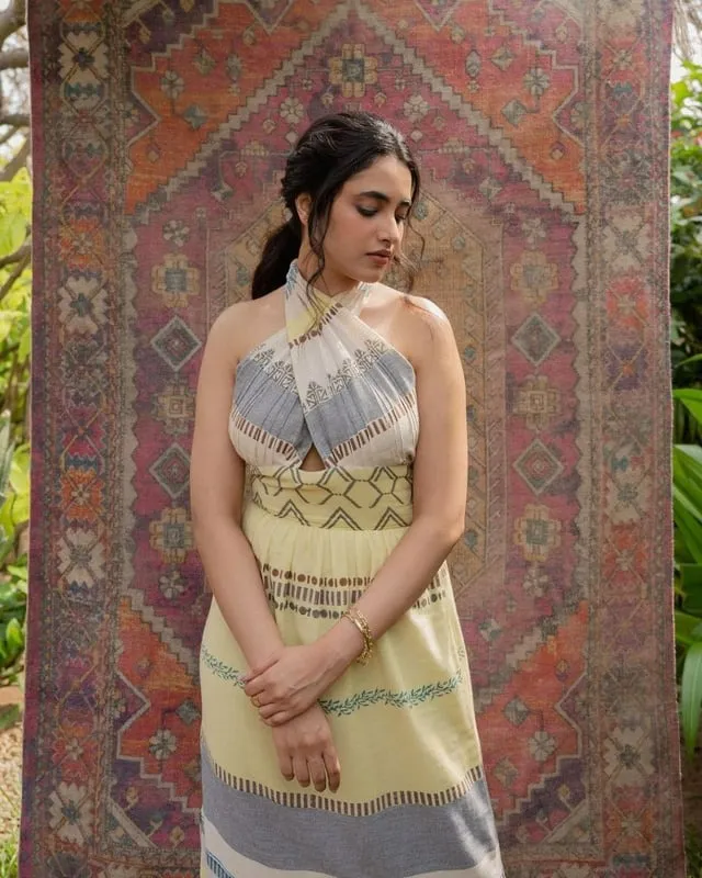 Priyanka posing thoughtfully against colourful Carpet image
