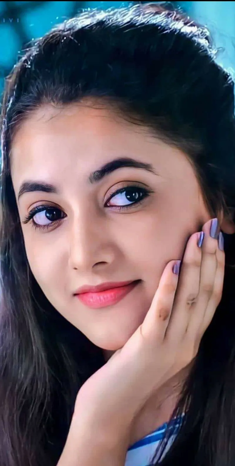 Priyanka with playful expression and dark background image