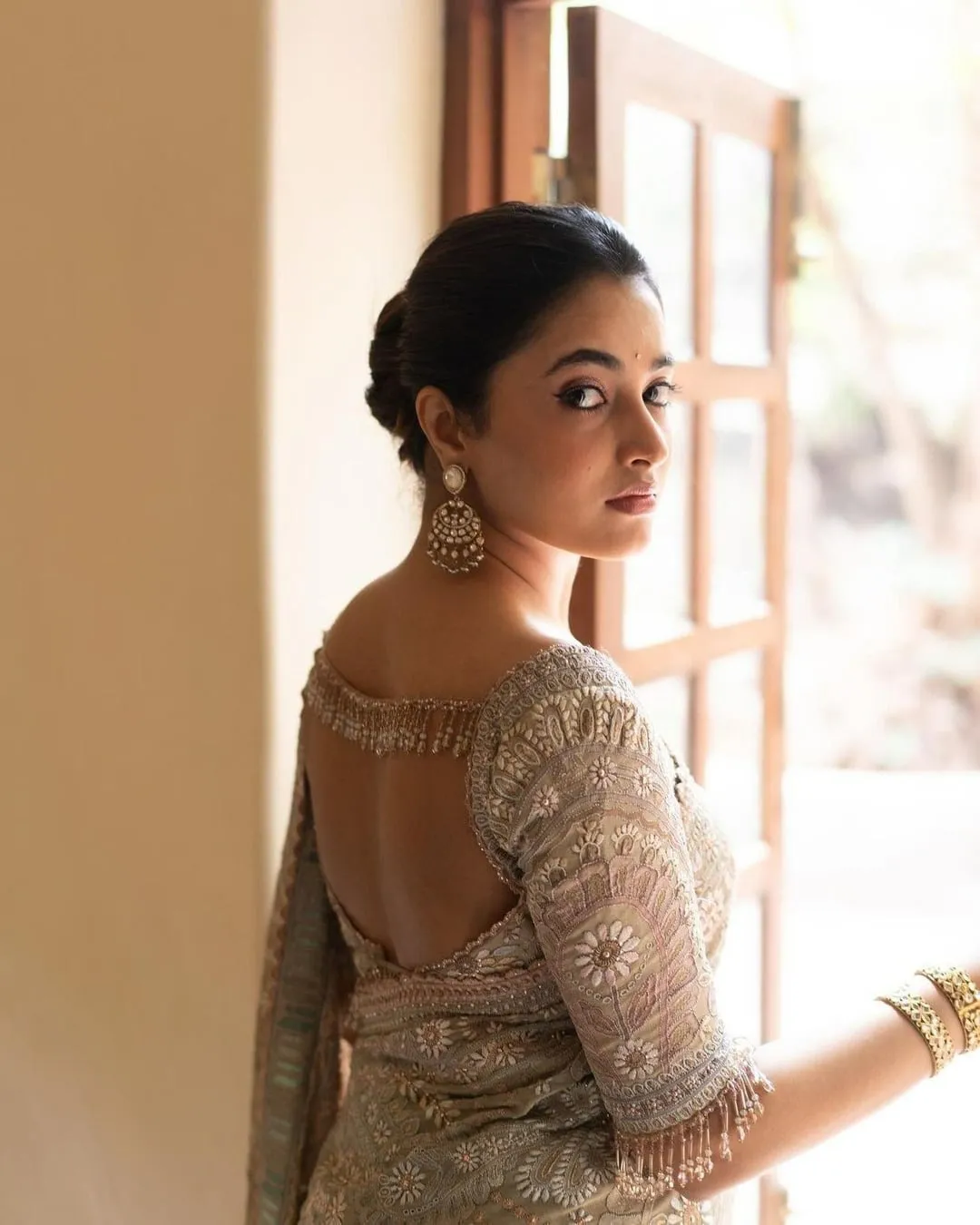 Serene Priyanka Arul Mohan in lace blouse near window light