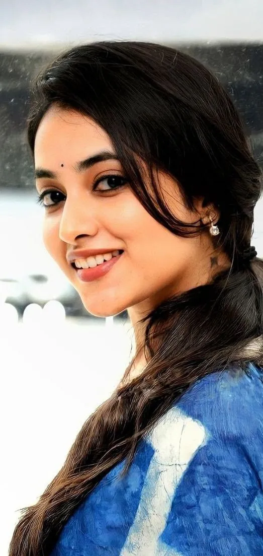Smiling Priyanka in blue dress with hairstyle Wallpaper