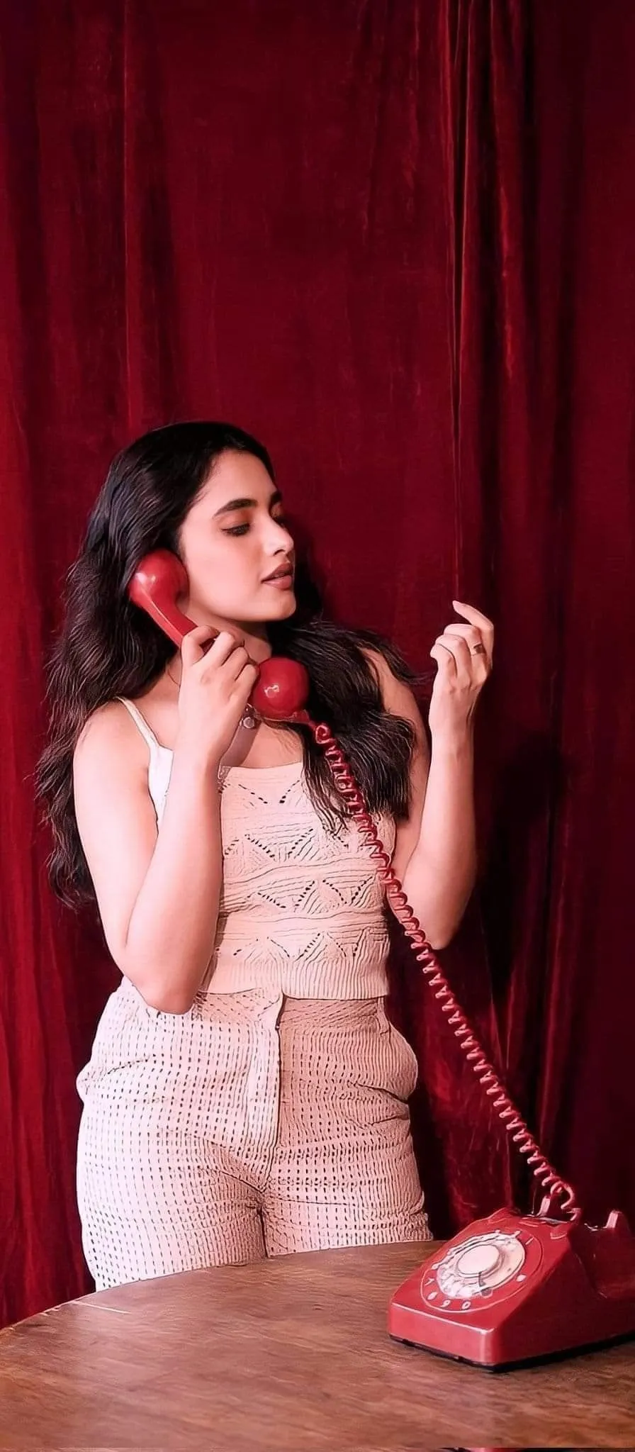 Stunning Image of Priyanka Mohan Holding Red Landline Phone
