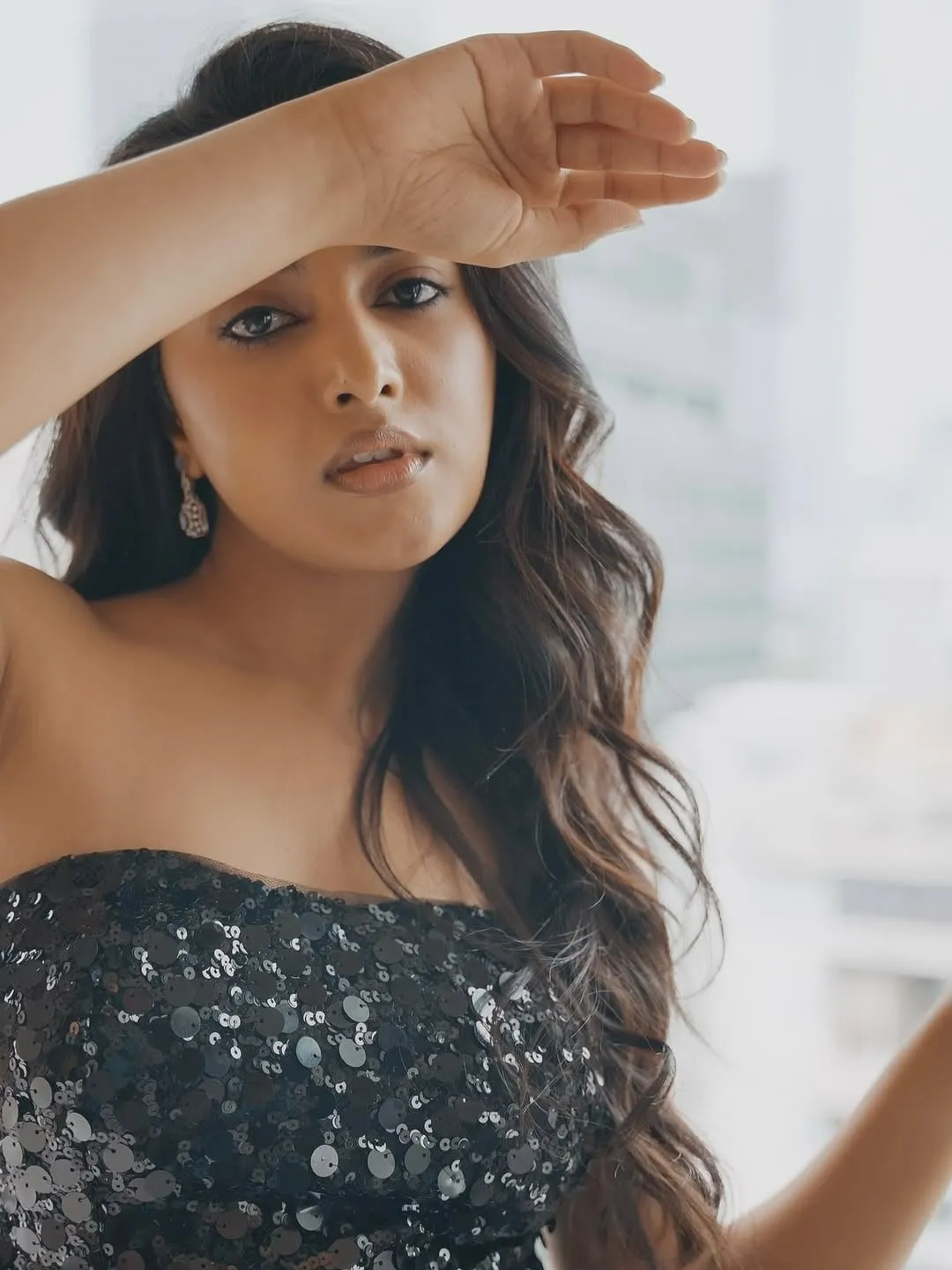 Stylish Priyanka Arul Mohan in black strapless gown pose