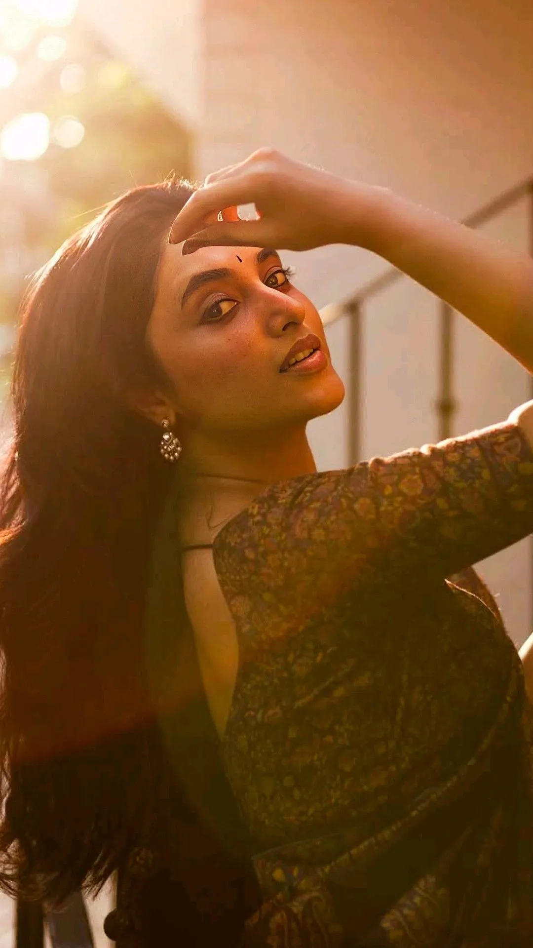 Sunlit Portrait of Priyanka Mohan with Hand on Forehead