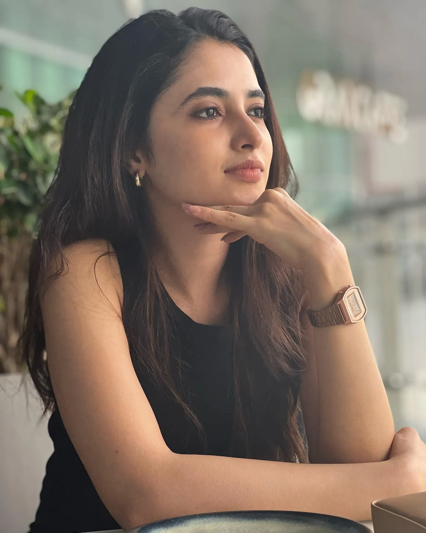Thoughtful Priyanka Arul Mohan resting chin on hand image