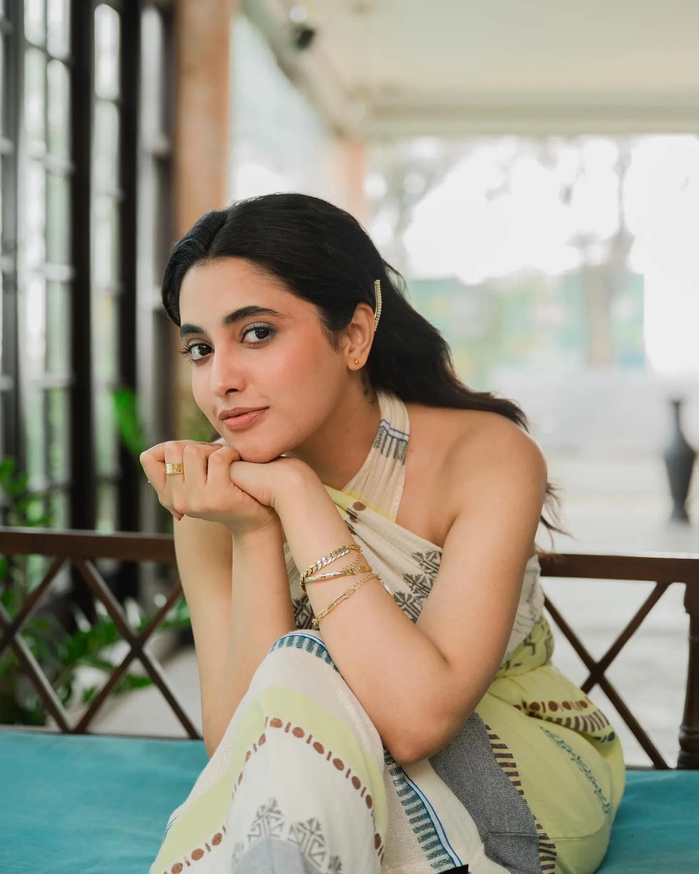 Thoughtful Priyanka Arul Mohan Sitting On a balcony image