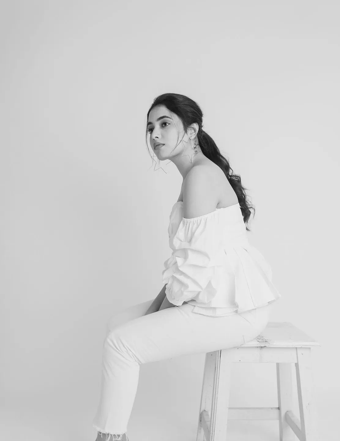 White Minimalist Pose of Priyanka Arul Mohan sitting image